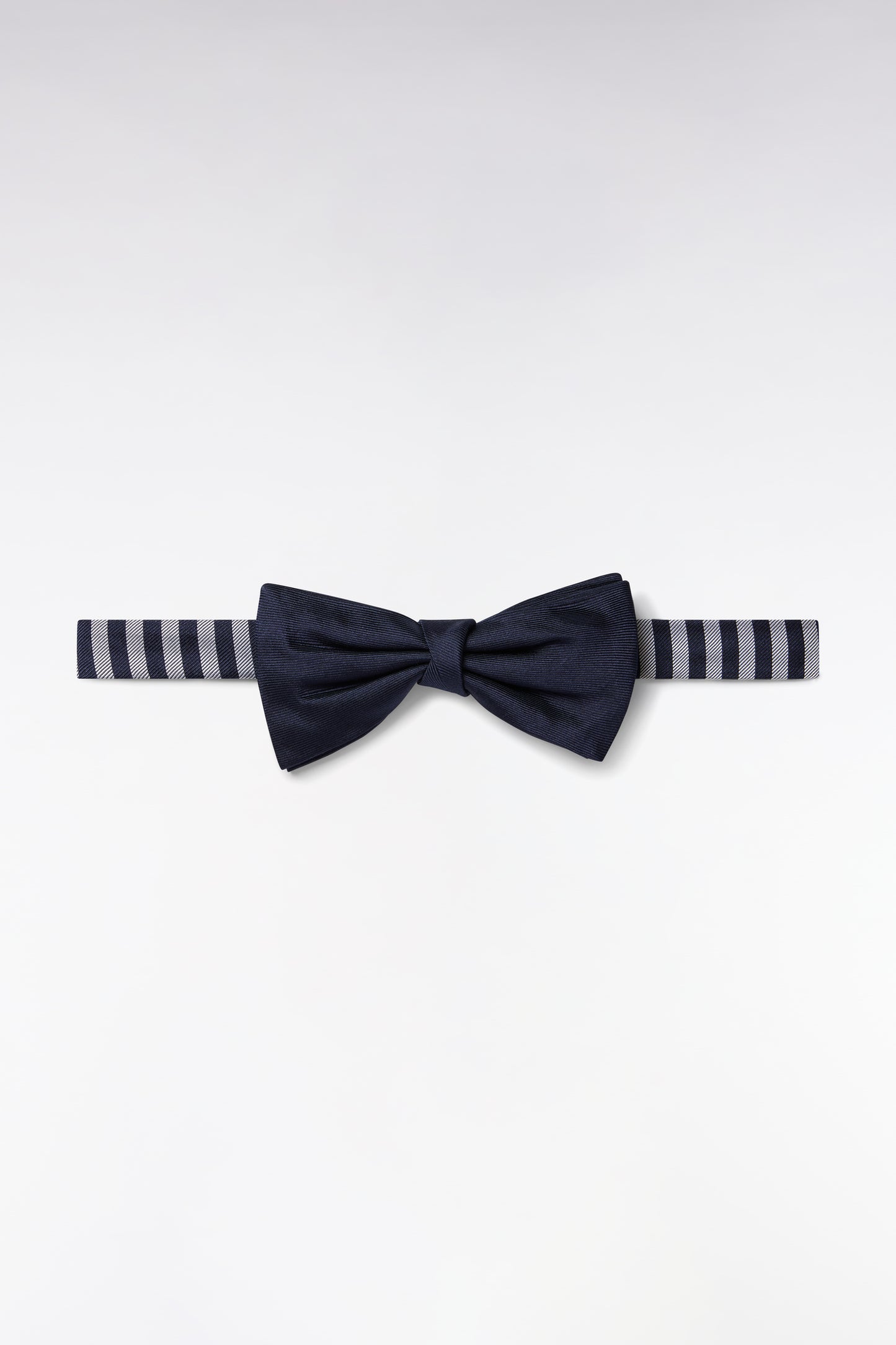 Navy silk bow tie with striped-necked neckline