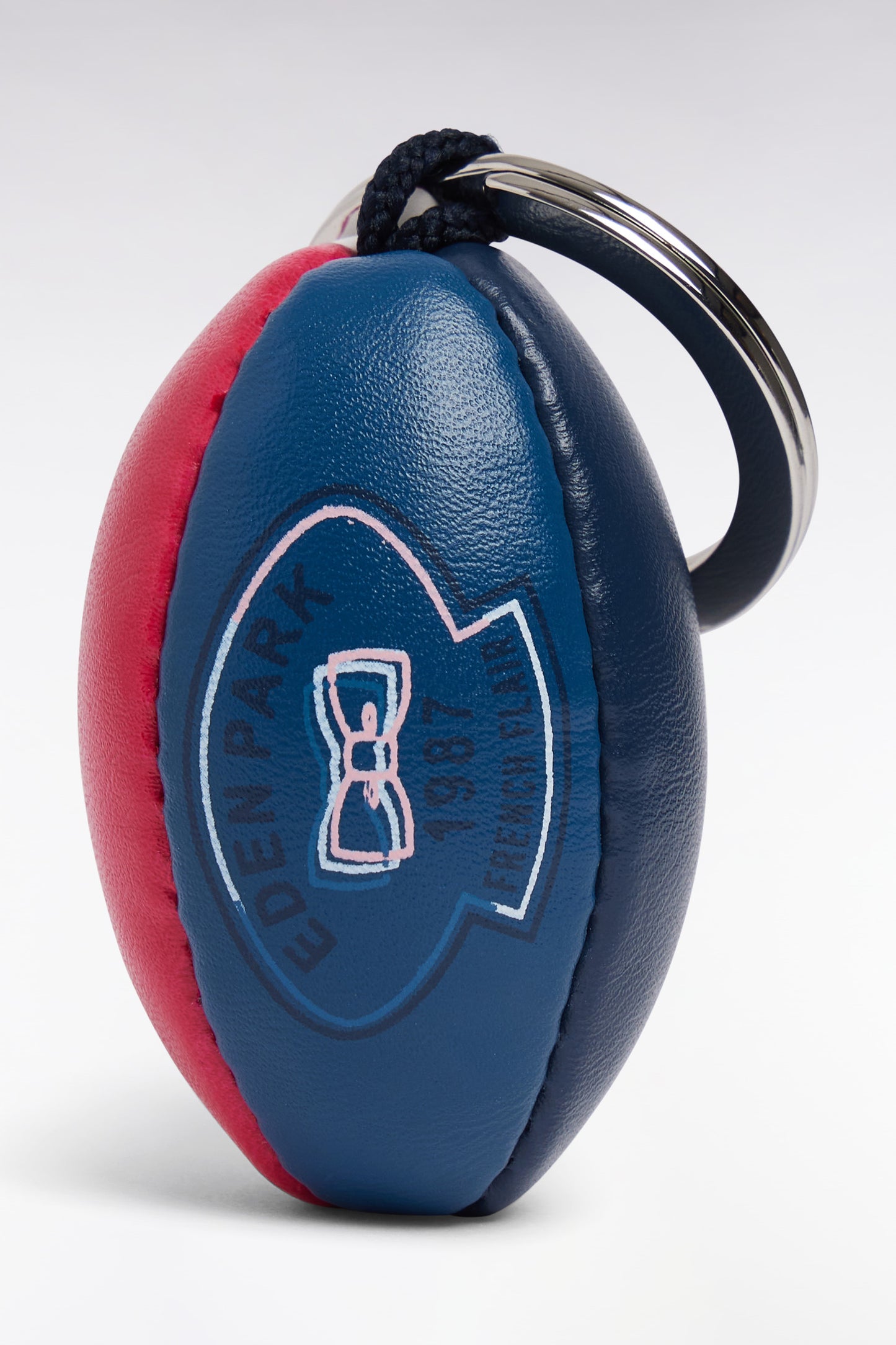 Rugby ball keyring in fuchsia synthetic leather