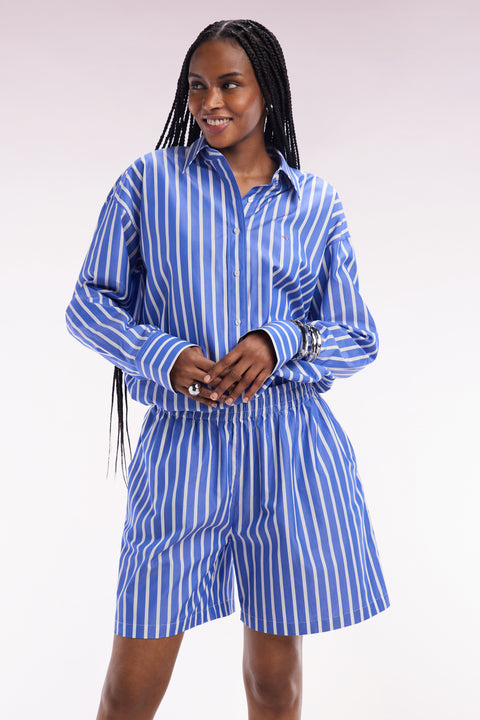 Blue oversized cotton shorts with white stripes - Image 1