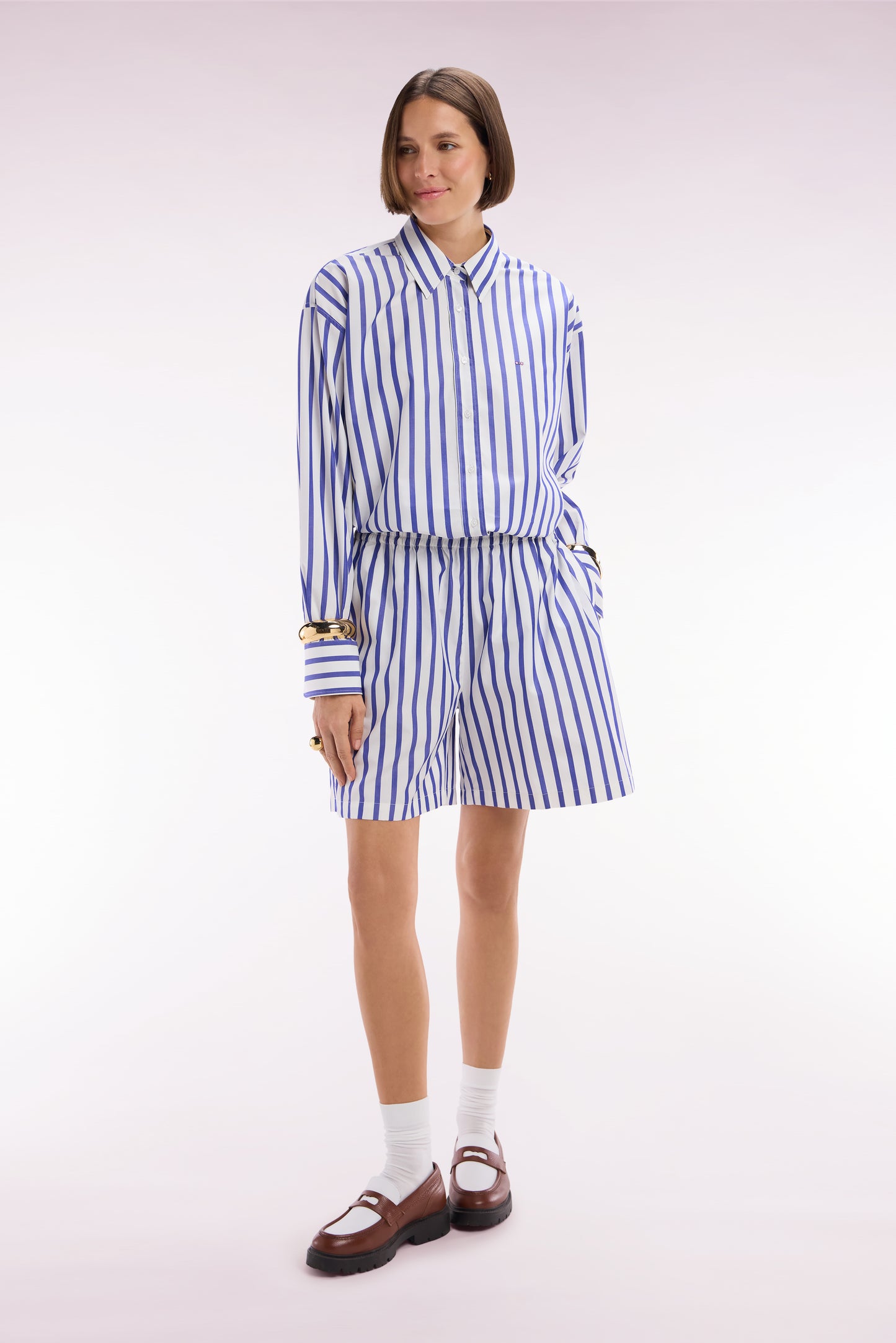 White oversized cotton shorts with blue stripes
