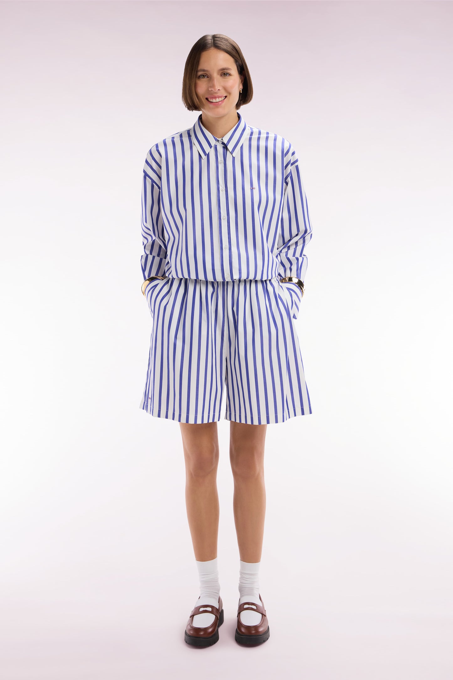 White oversized cotton shorts with blue stripes