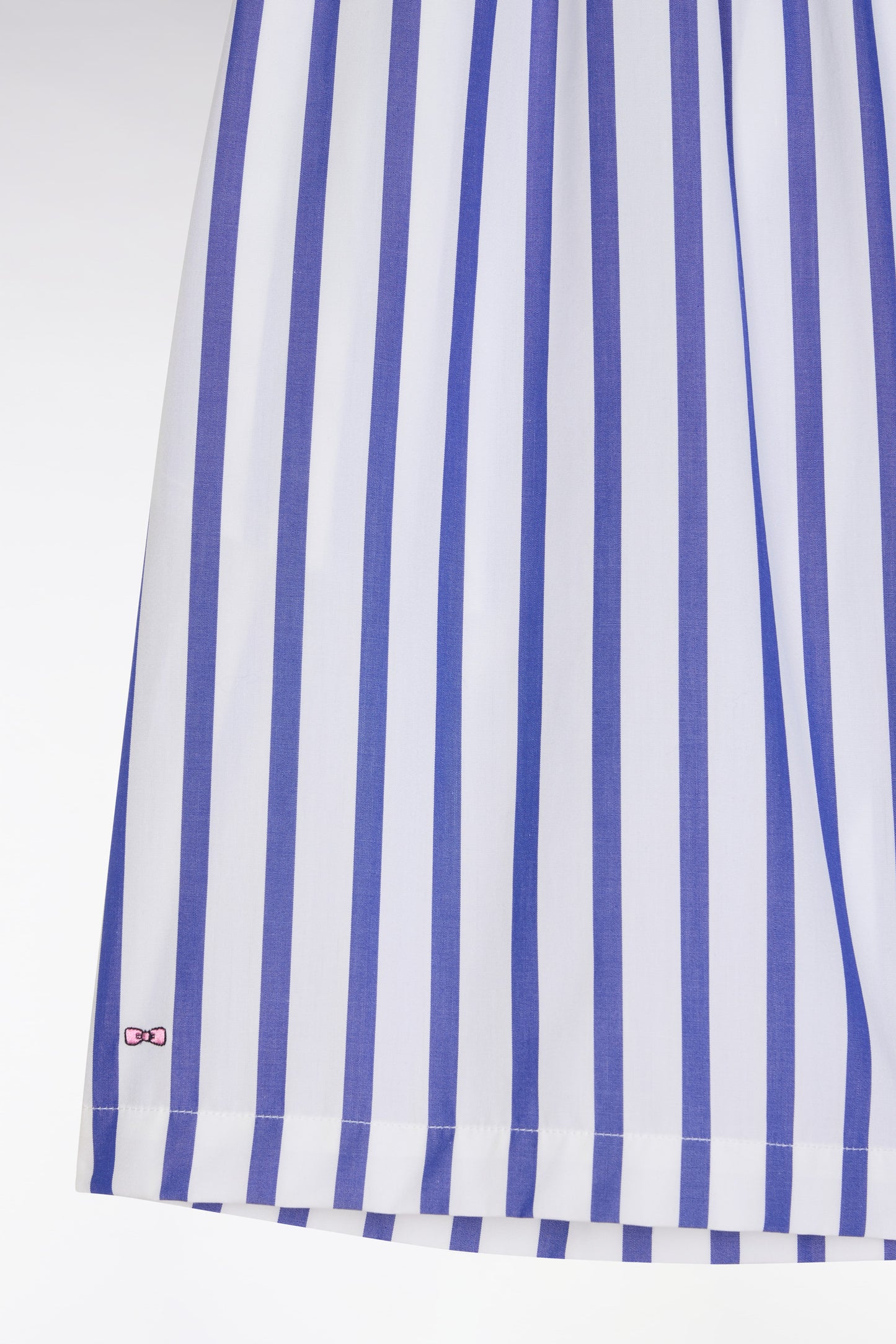 White oversized cotton shorts with blue stripes