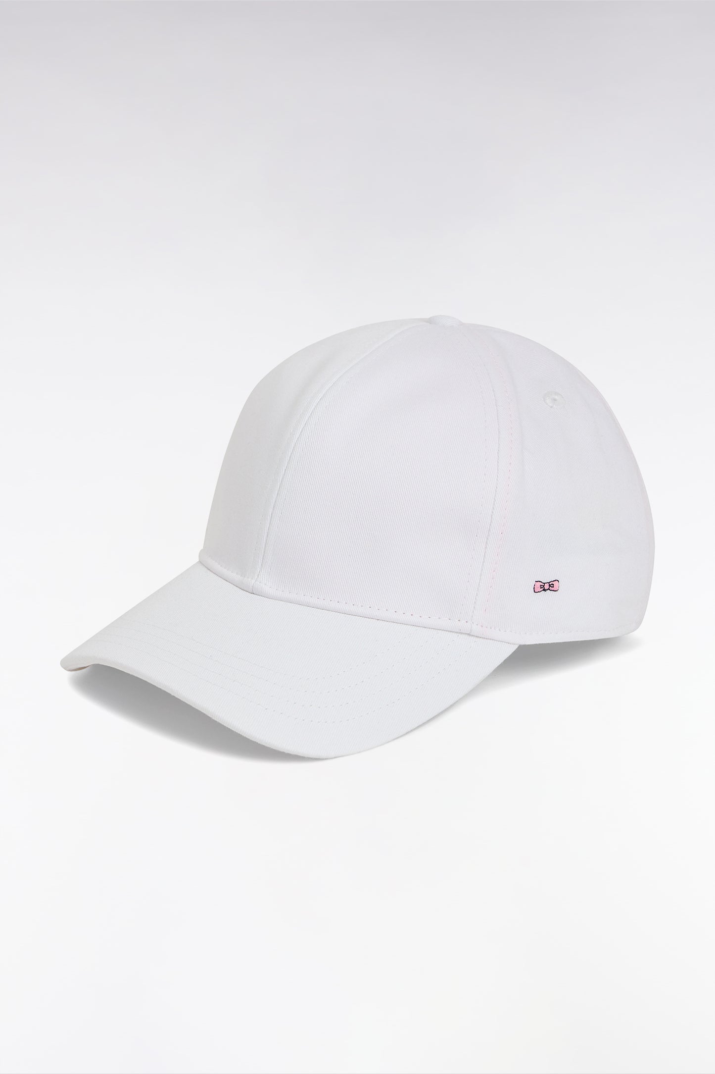 White cotton twill cap with bow tie embroidery