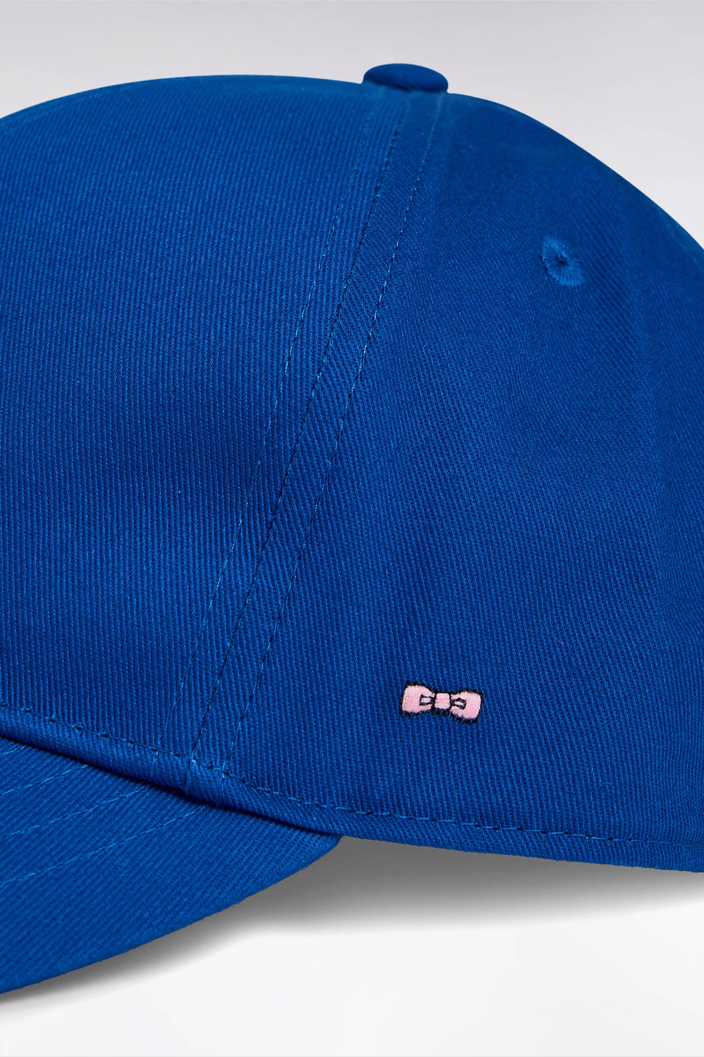 Navy cotton twill cap with bow tie embroidery