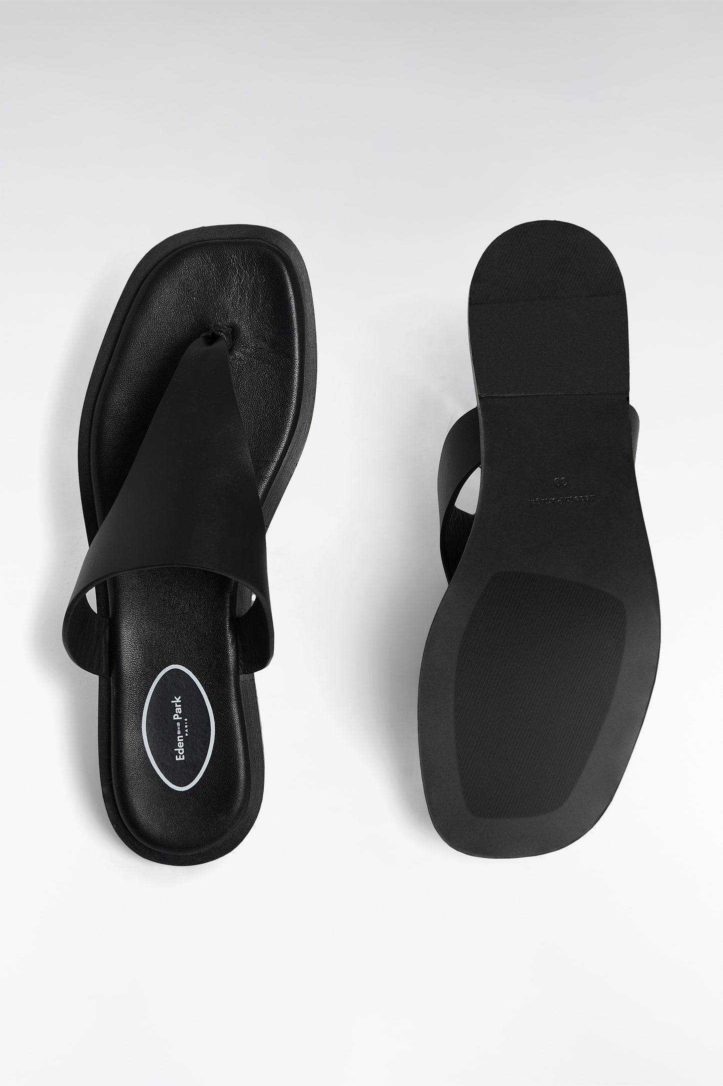 Black cowhide thong sandals