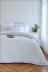 Comforter cover in white cotton percale with sky stripe border