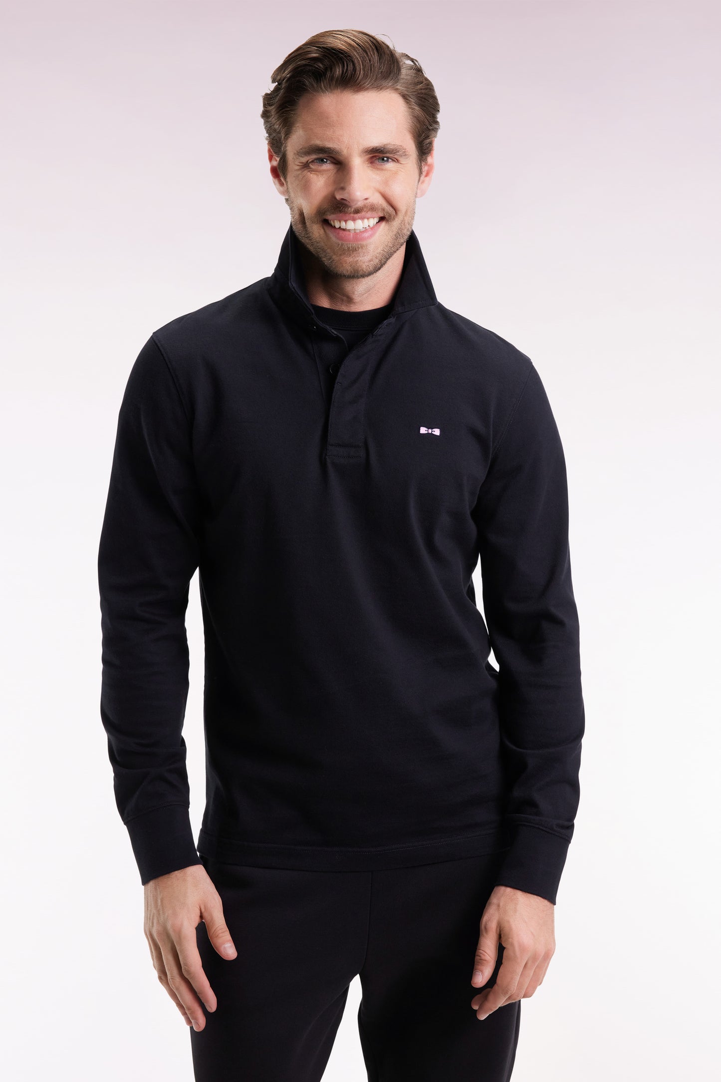 Long-sleeved jersey in thick black cotton jersey with bow tie embroidery, straight cut