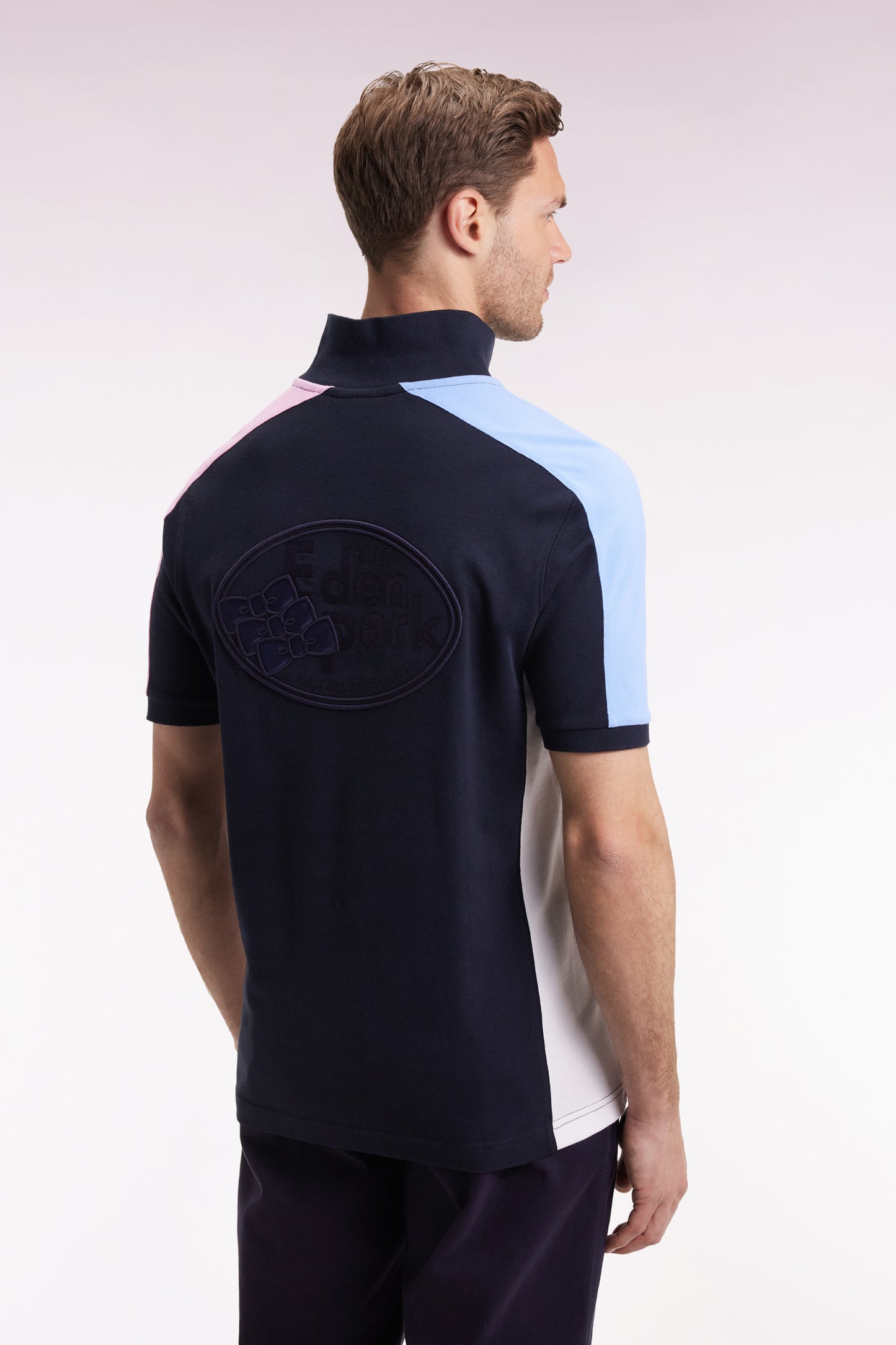 Short-sleeved polo shirt in navy cotton piqué with tricolored cut-outs