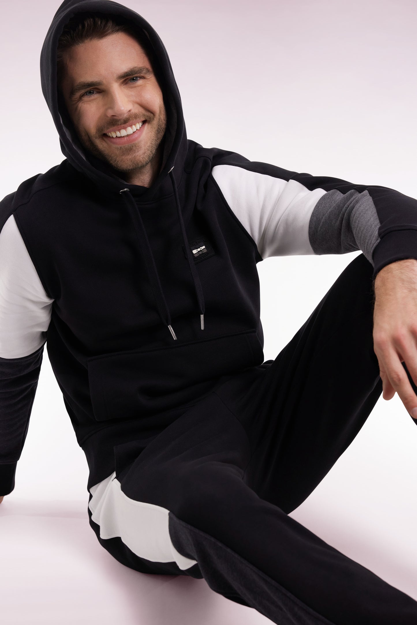 Black hooded sweatshirt with contrasting cut-out sleeves