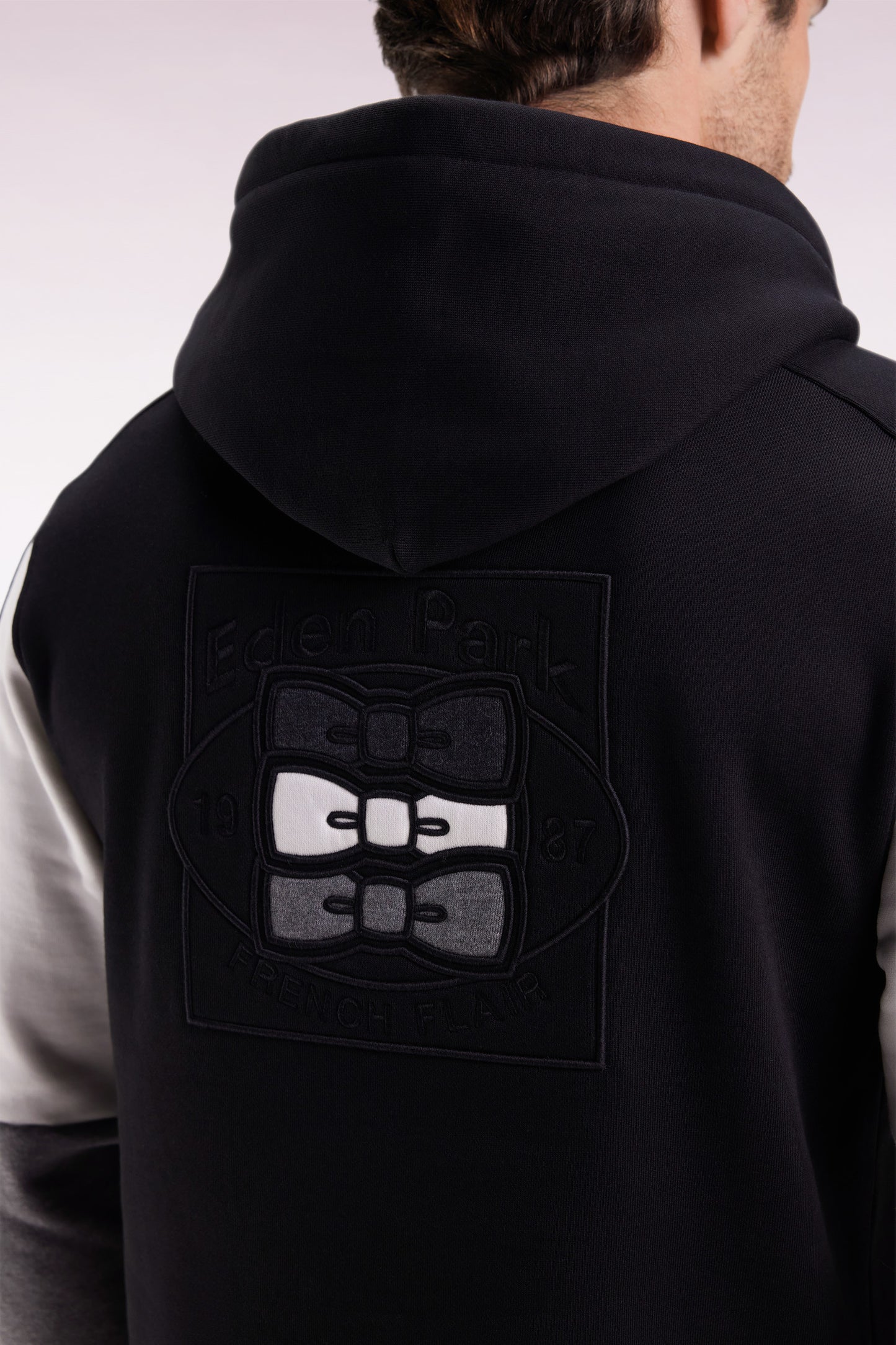 Black hooded sweatshirt with contrasting cut-out sleeves