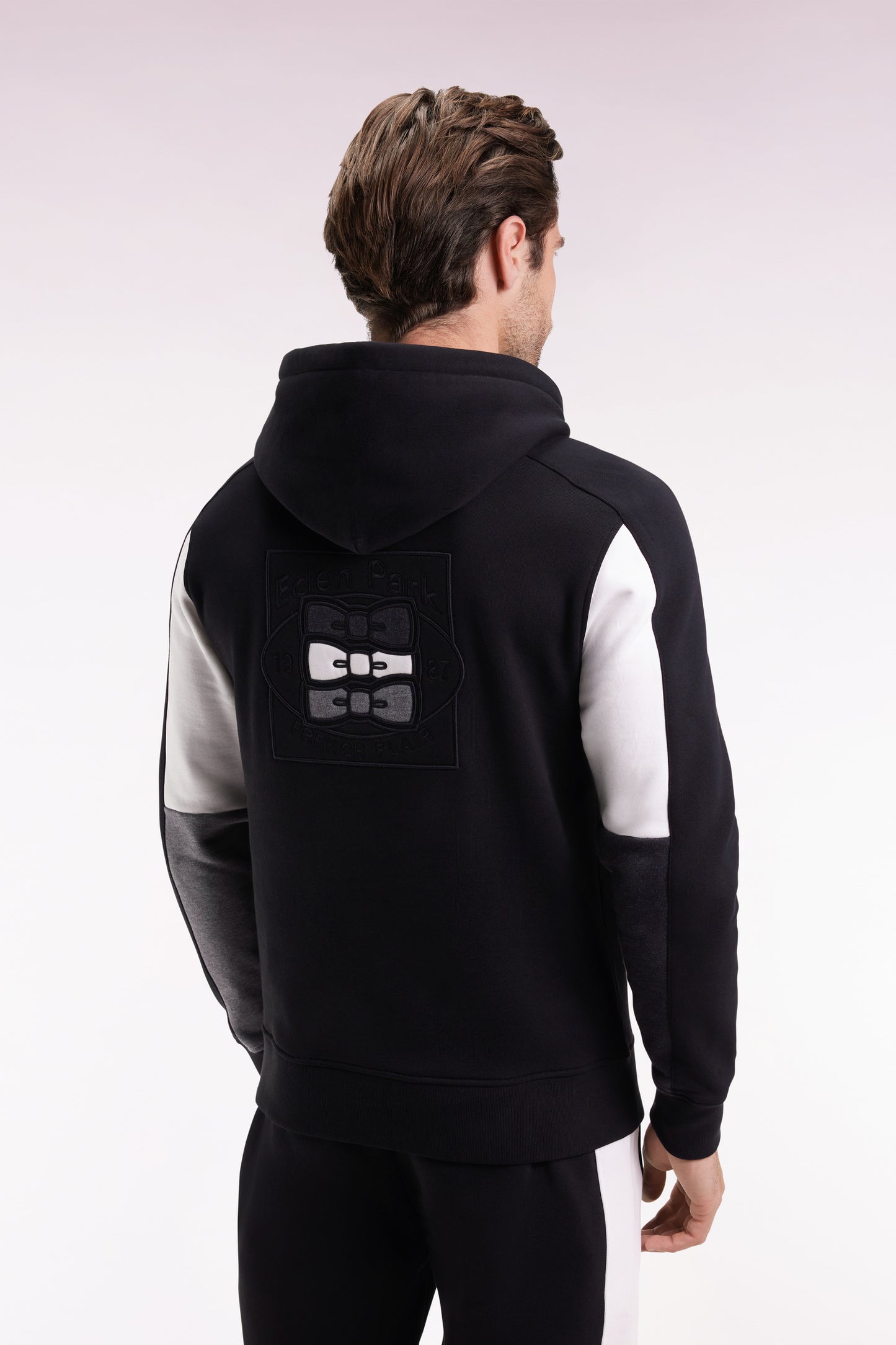 Black hooded sweatshirt with contrasting cut-out sleeves