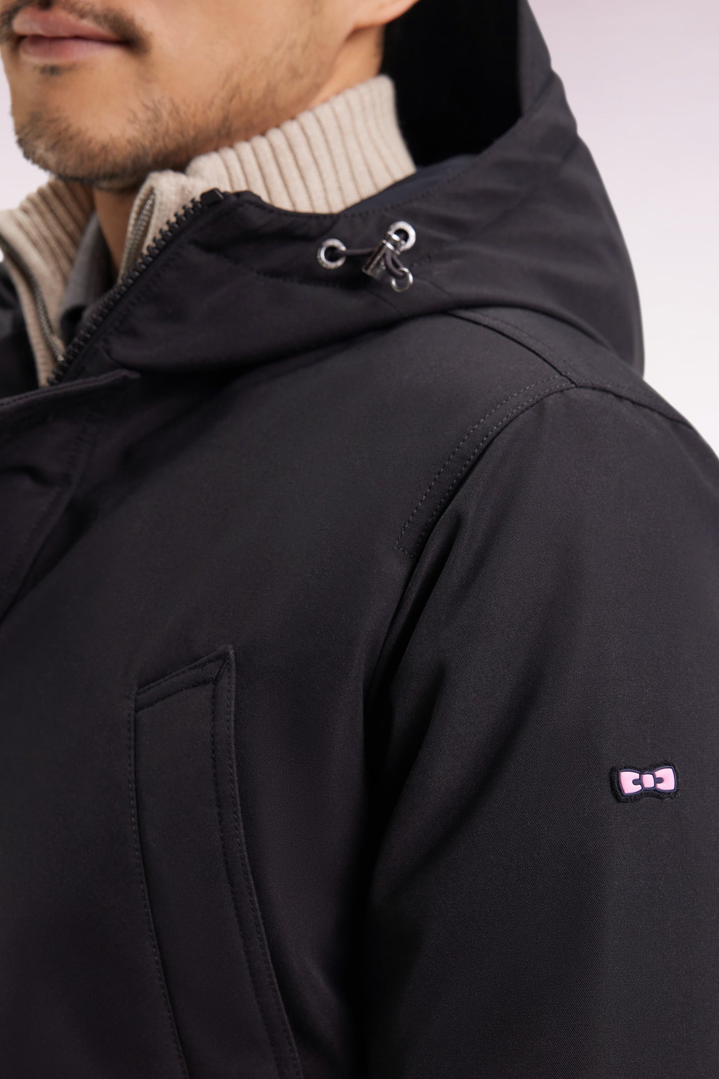 Short parka in black nylon with patch pockets