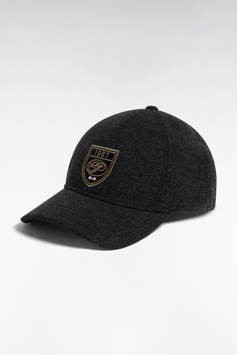 Charcoal herringbone woolen cloth cap with crest patch - Image 1