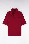Short-sleeved red cotton polo shirt with oversized cut