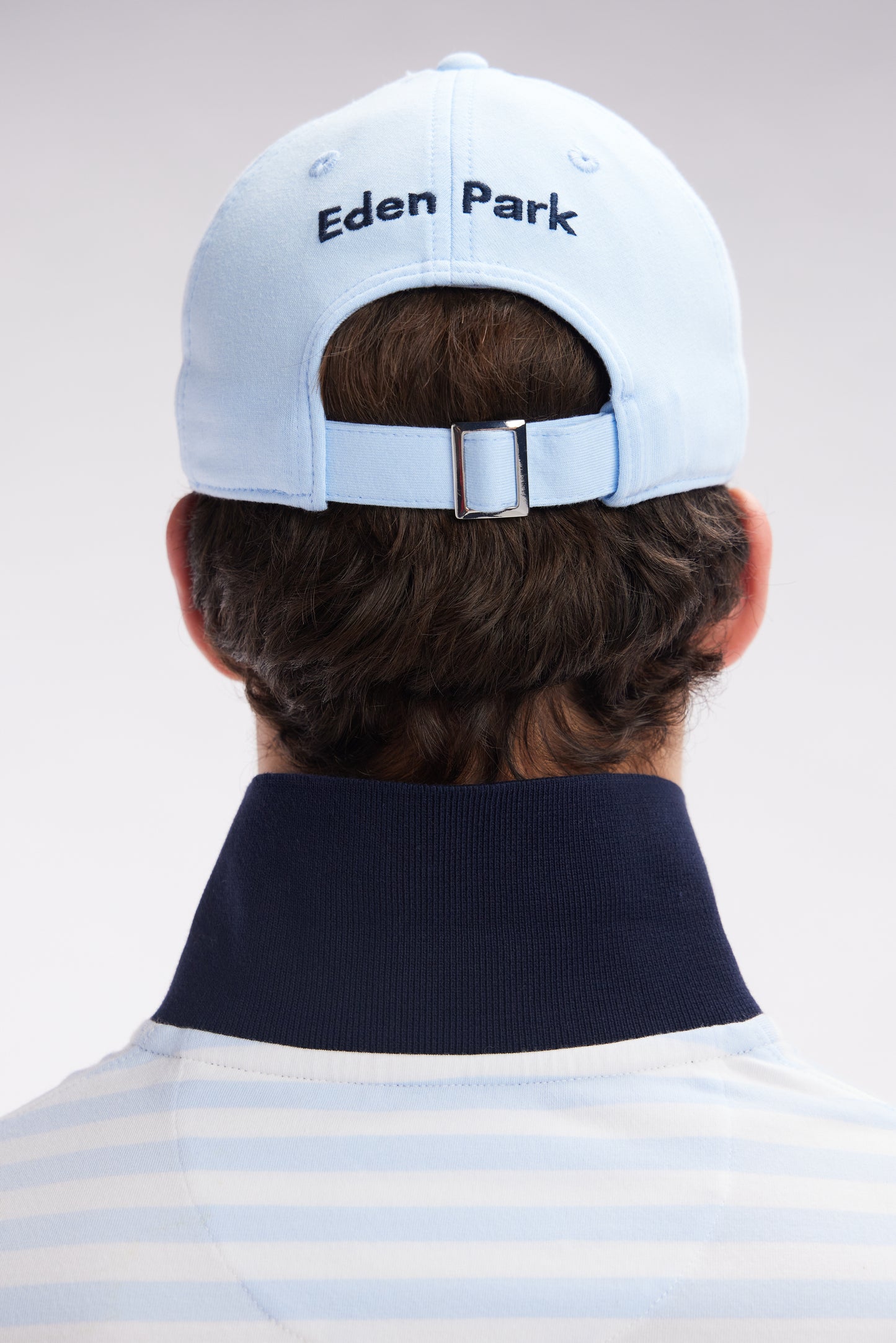 Sky blue cotton jersey cap with striped bow tie logo
