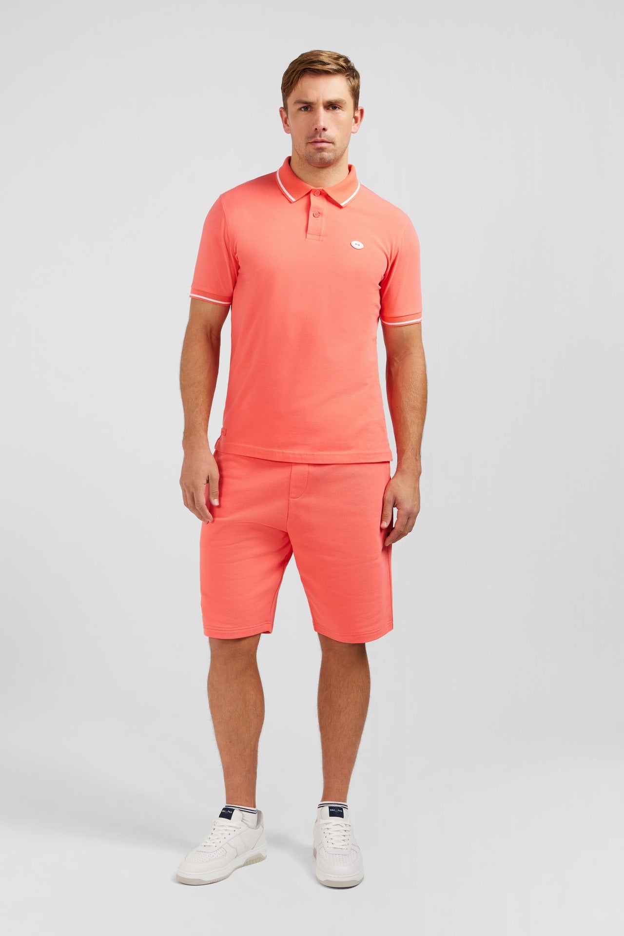 Pink short-sleeved polo shirt