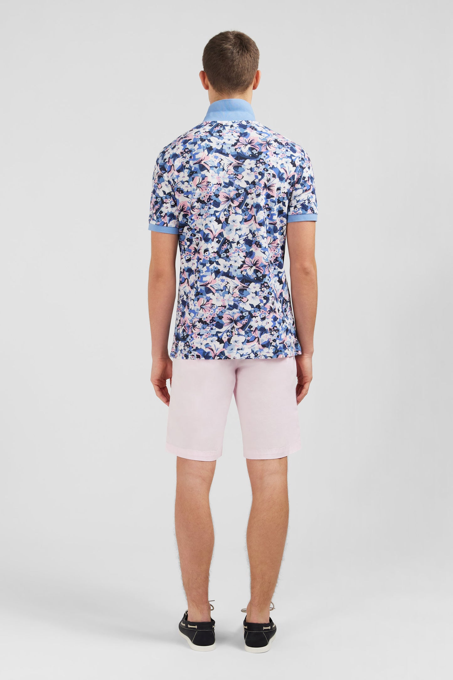 Light blue short-sleeved polo shirt with flower print