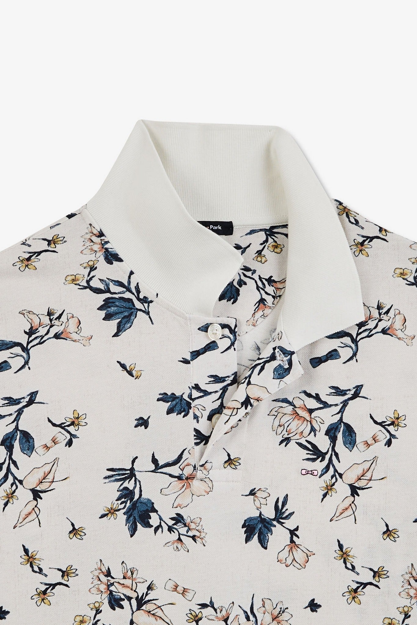 White polo shirt with an exclusive floral print