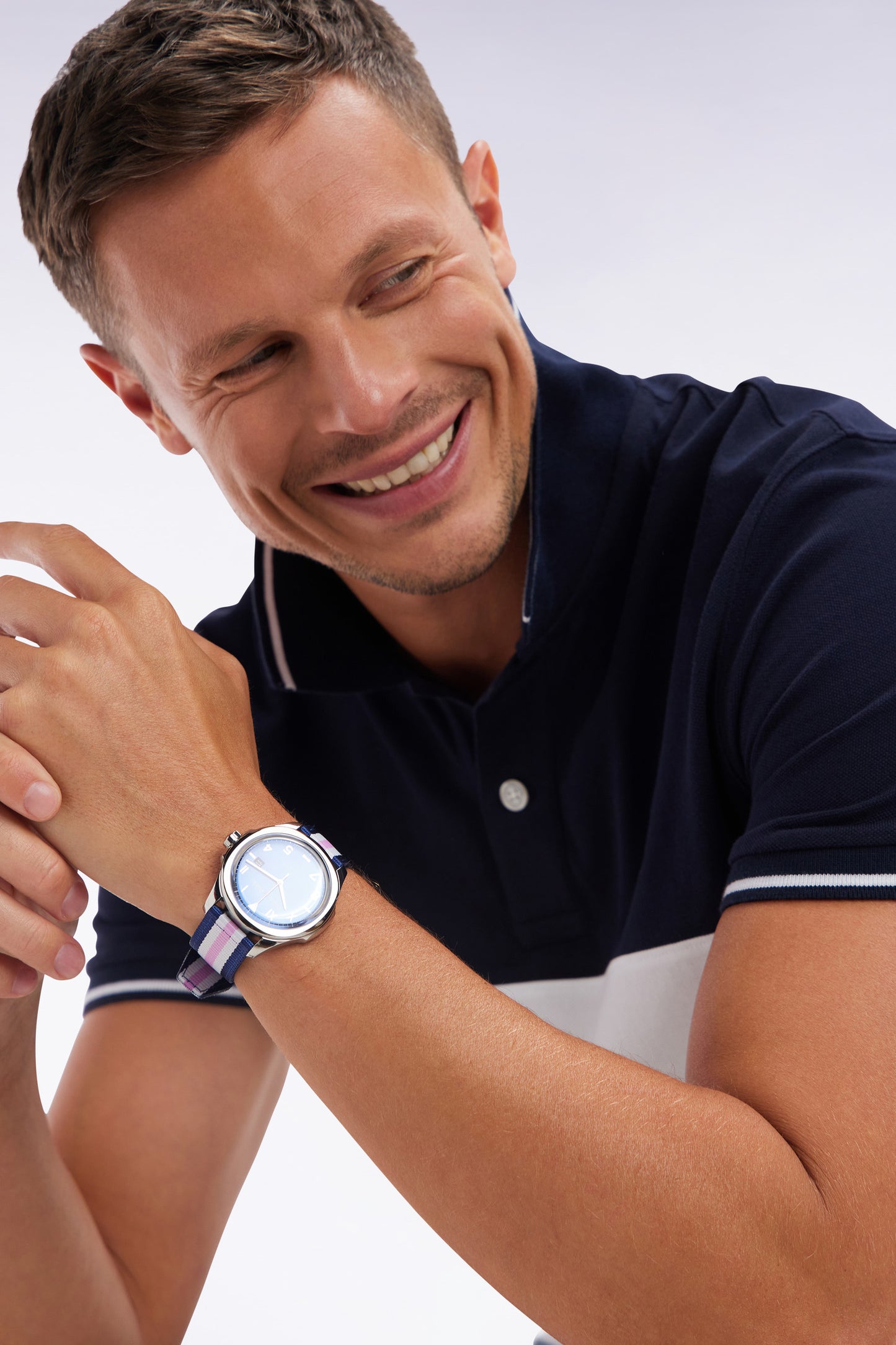 Quartz watch with blue background and three-tone NATO strap