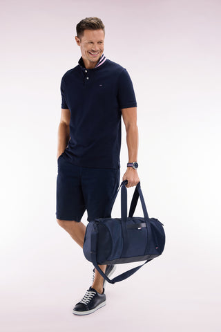 Navy and black duffle bag in leather and fabric