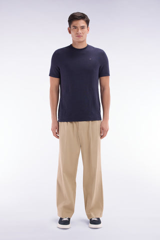 Wide-leg beige pleated trousers in stretch lyocell and cotton