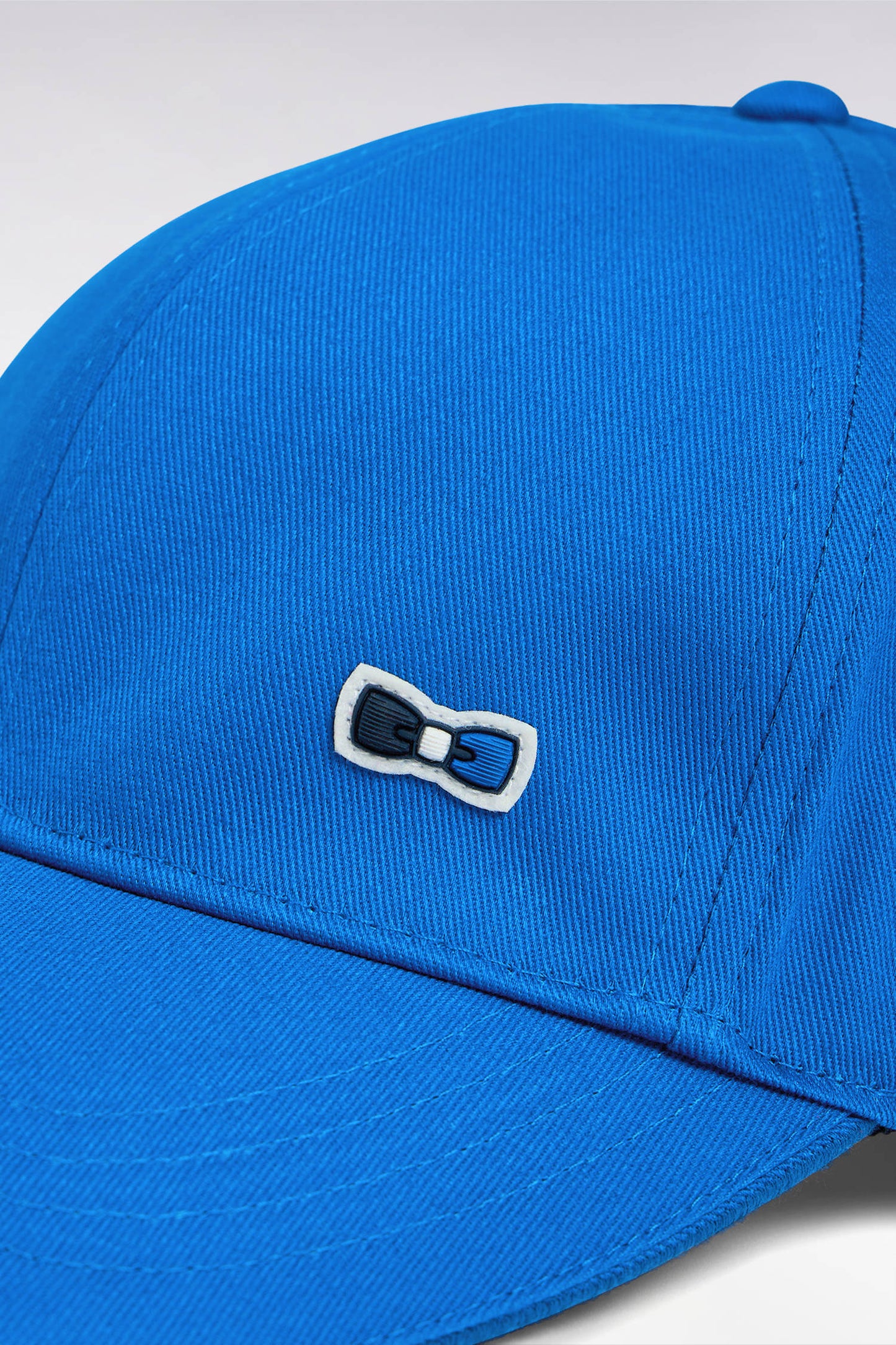 Blue cotton twill cap with piped visor