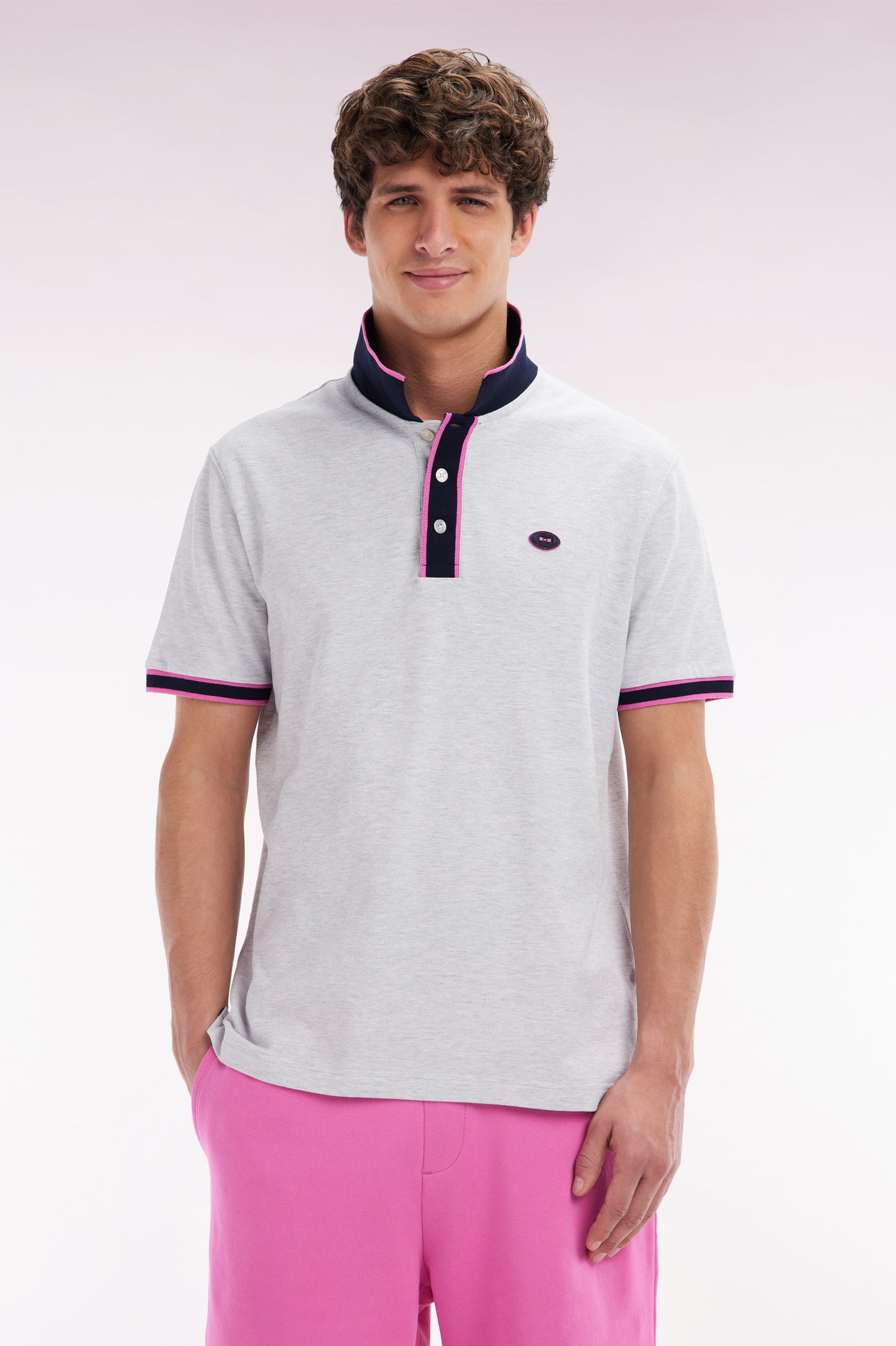 Relaxed-fit short-sleeved polo shirt in pink cotton with colorful stripes