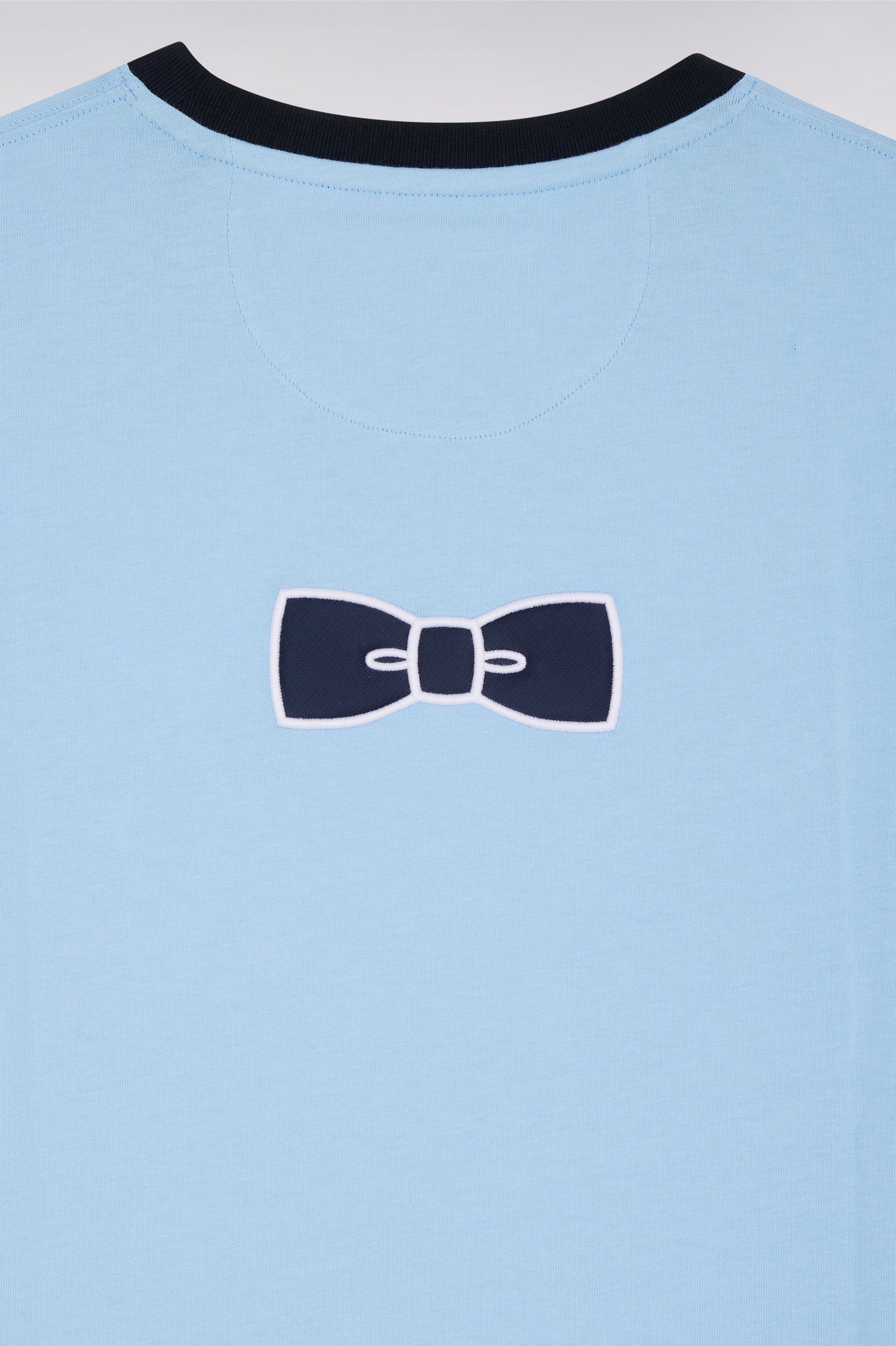Sky cotton T-shirt with embroidery and bow tie badge, straight cut