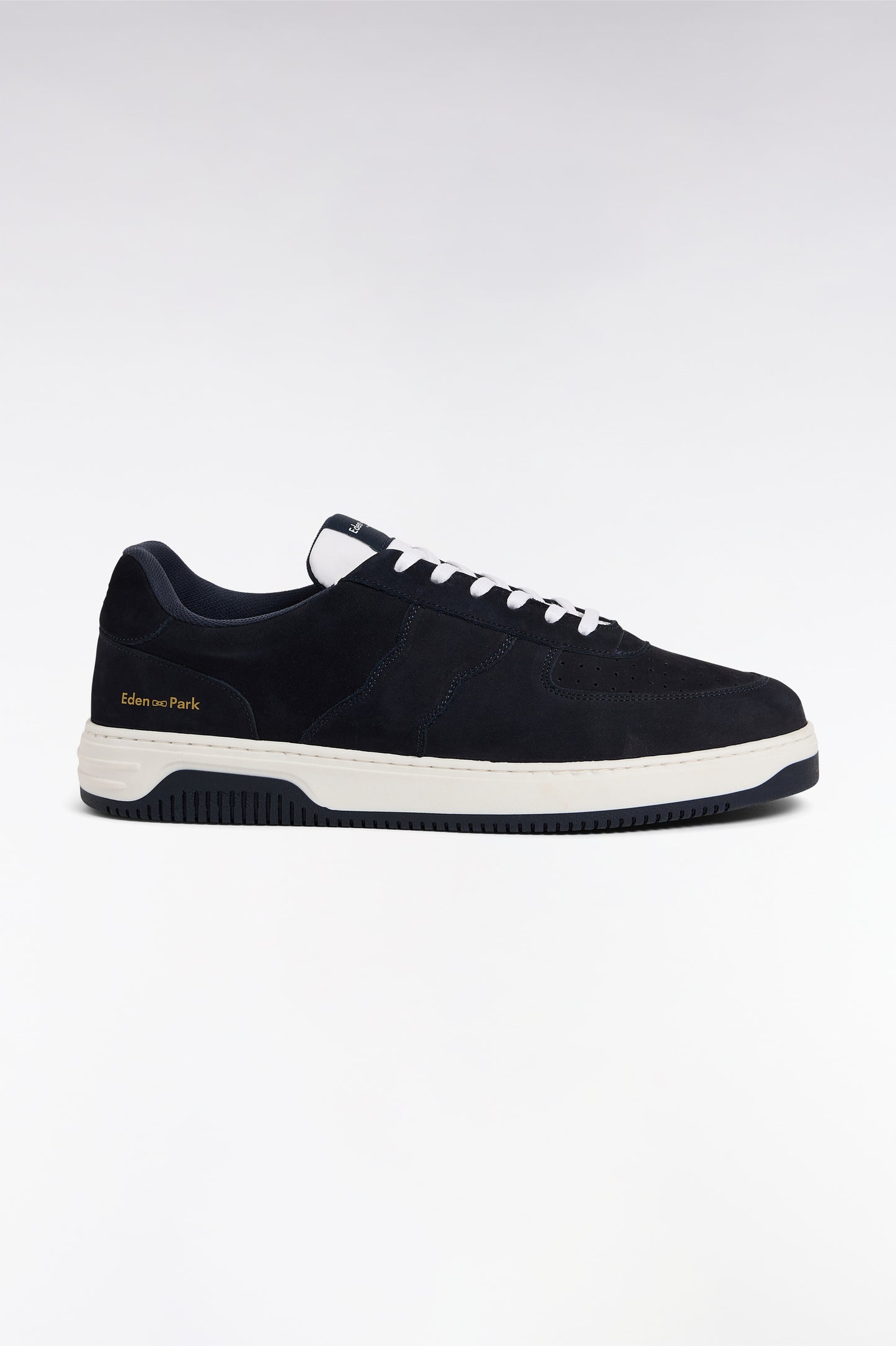 sneakers en cuir marine à semelles blanches