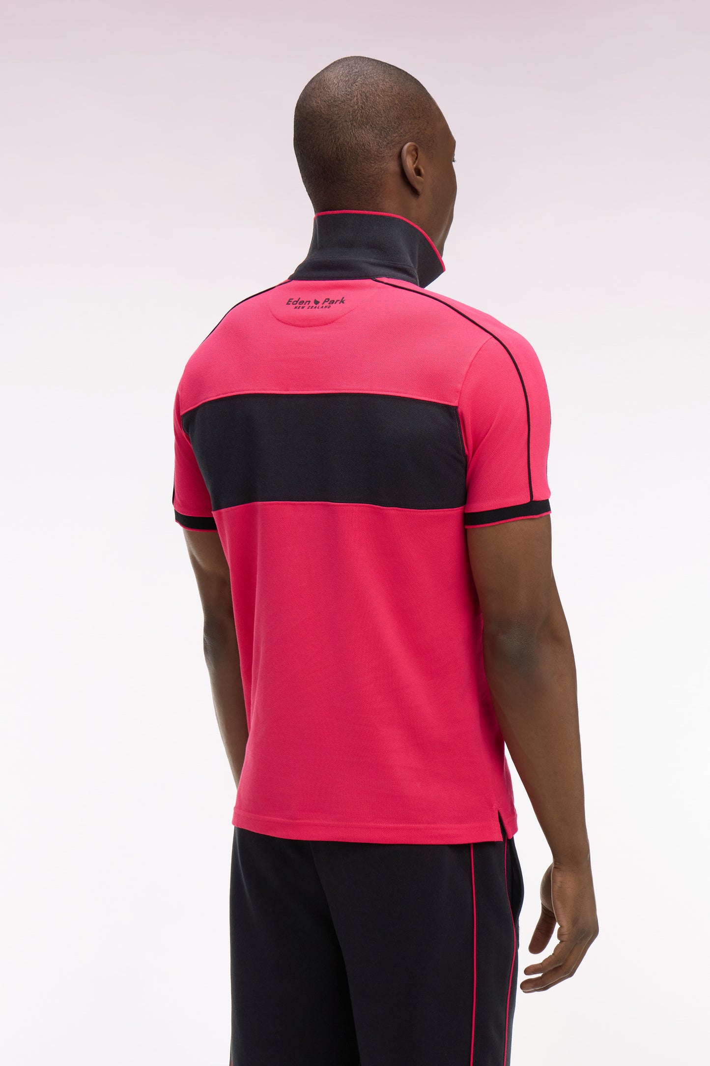 Polo à manches courtes en coton fuchsia et noir New Zealand coupe regular