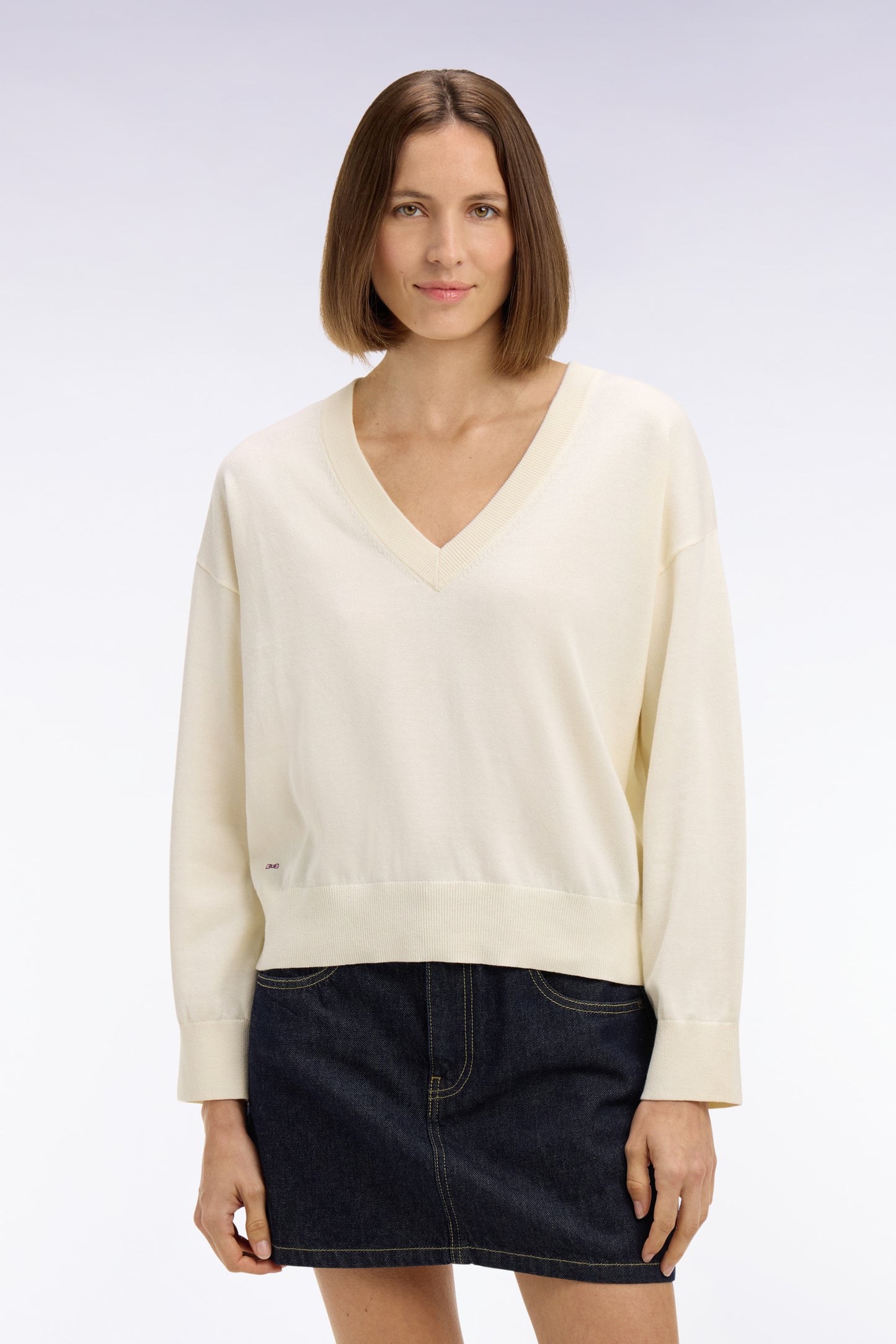 Oversized cut ecru cotton V-neck sweater
