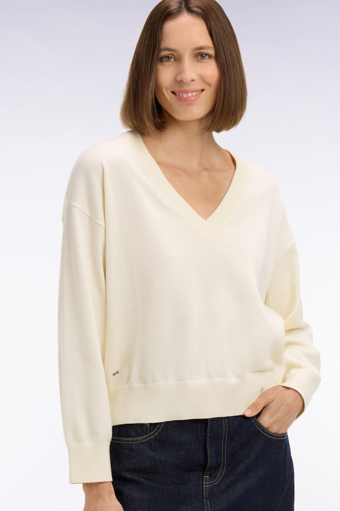 Oversized cut ecru cotton V-neck sweater
