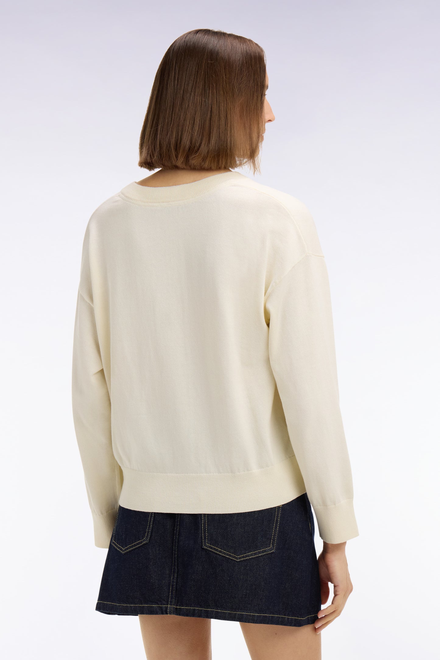 Oversized cut ecru cotton V-neck sweater