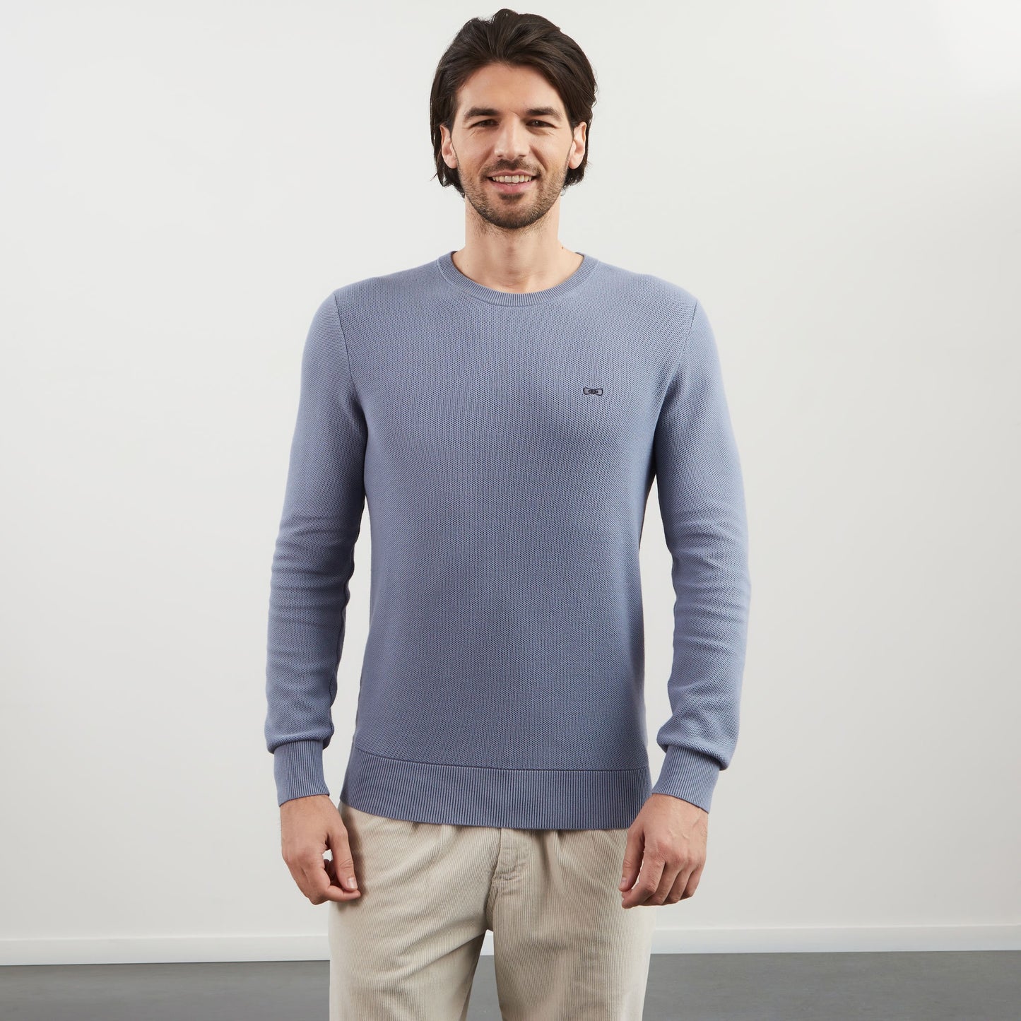 Grey jumper in decorative cable knit