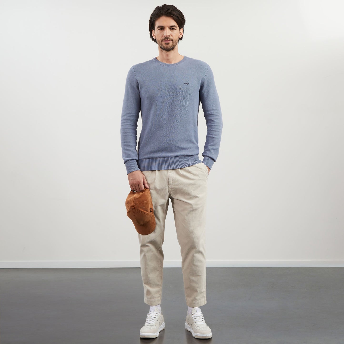 Grey jumper in decorative cable knit