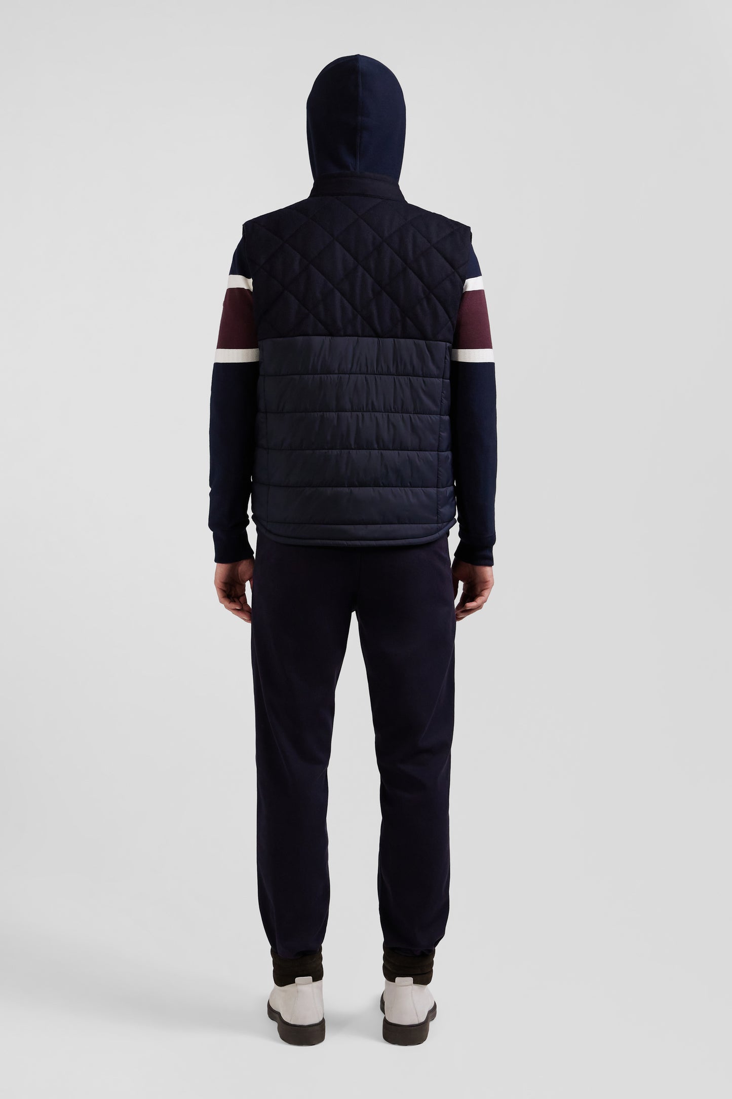 Navy blue sleeveless double quilted high collar down vest