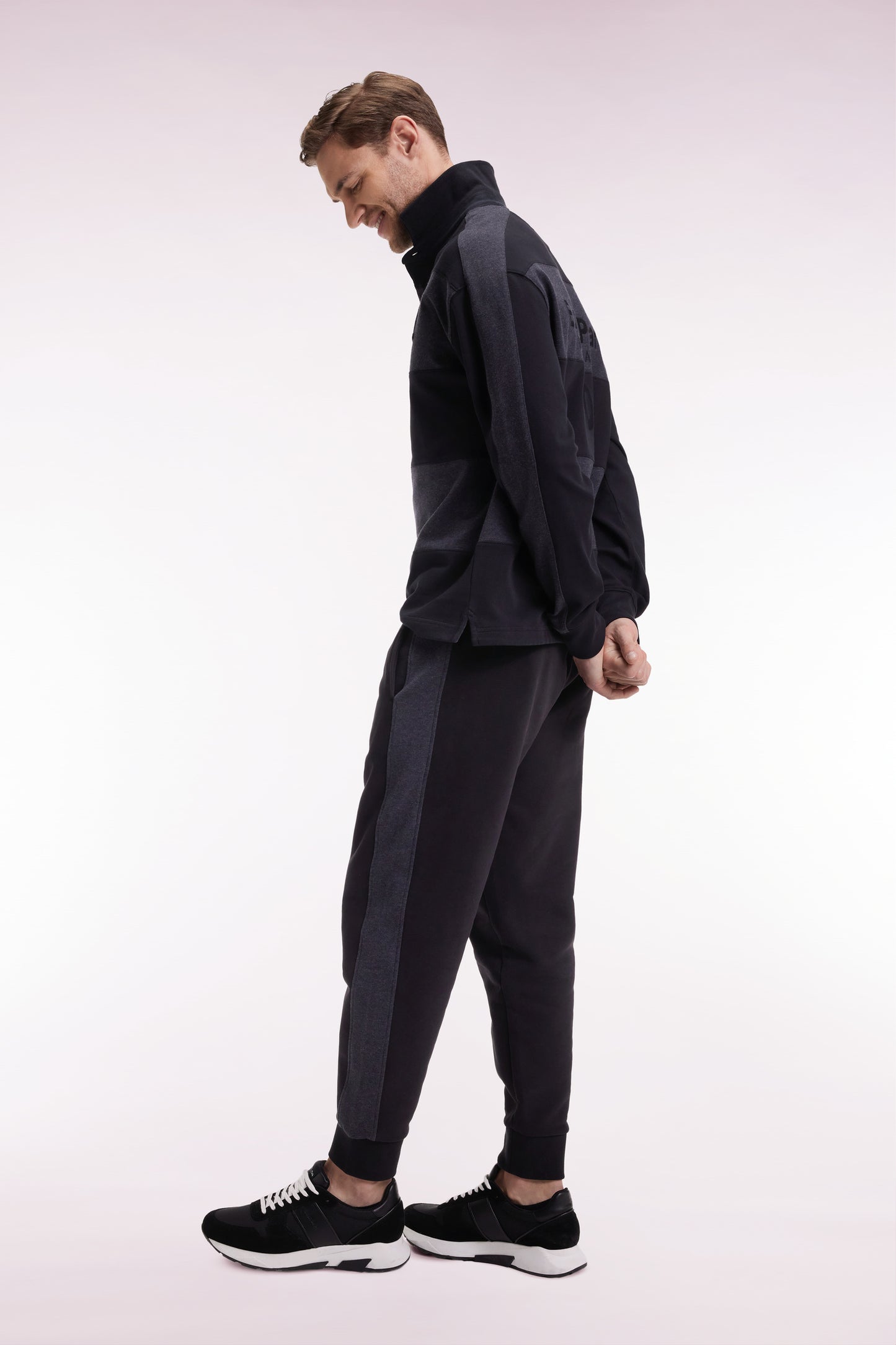 Black brushed fleece jogging suit with striped pockets Relaxed cut