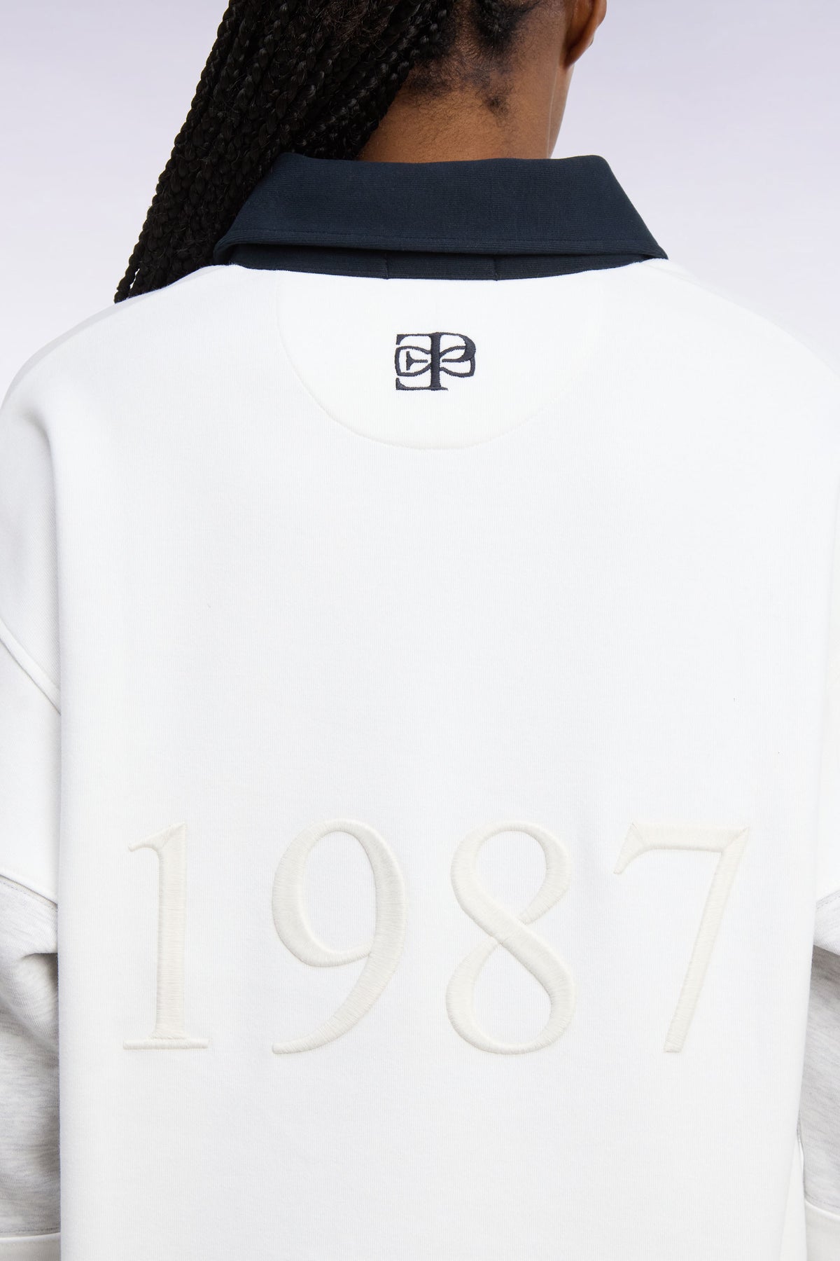 Unisex jersey collar sweatshirt in ecru interlock with heritage embroidery, loose cut