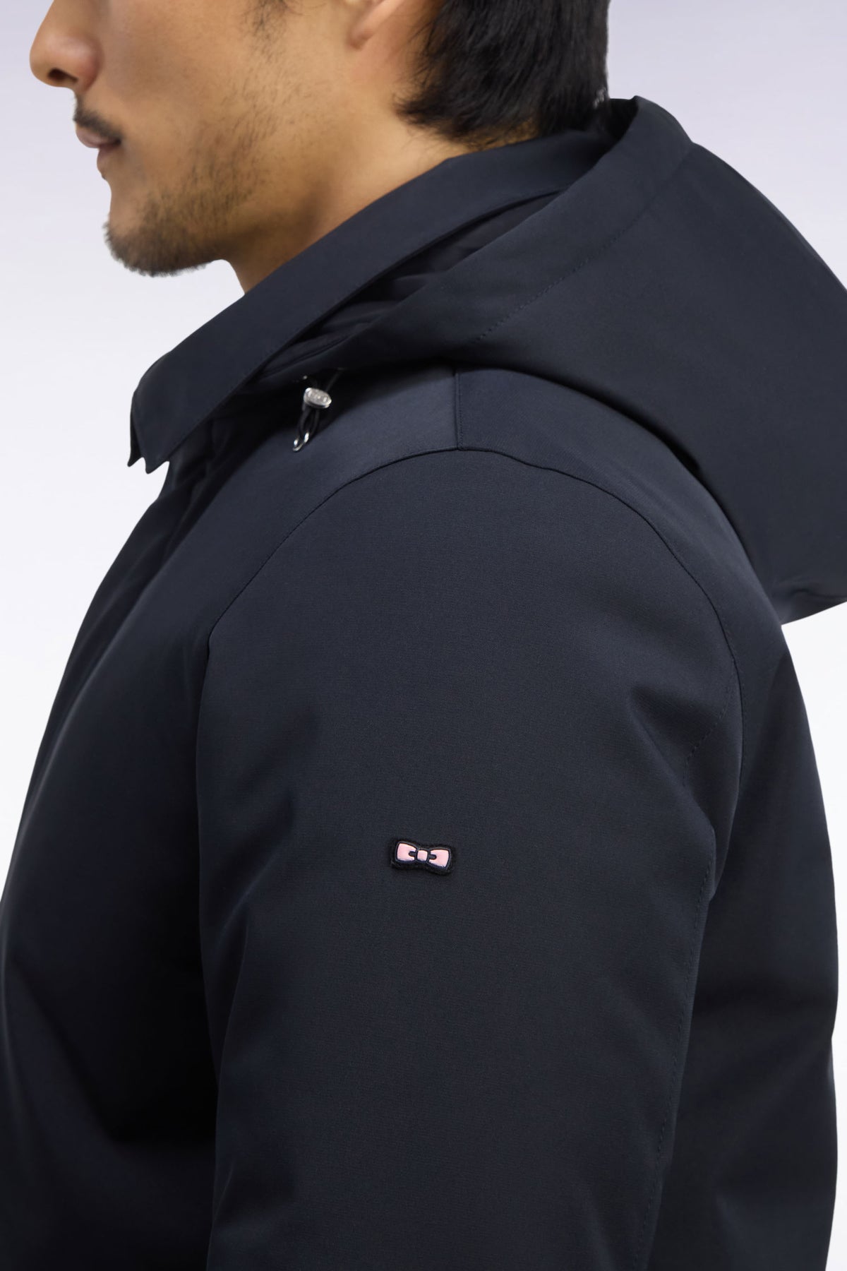 Black nylon raincoat with removable hood