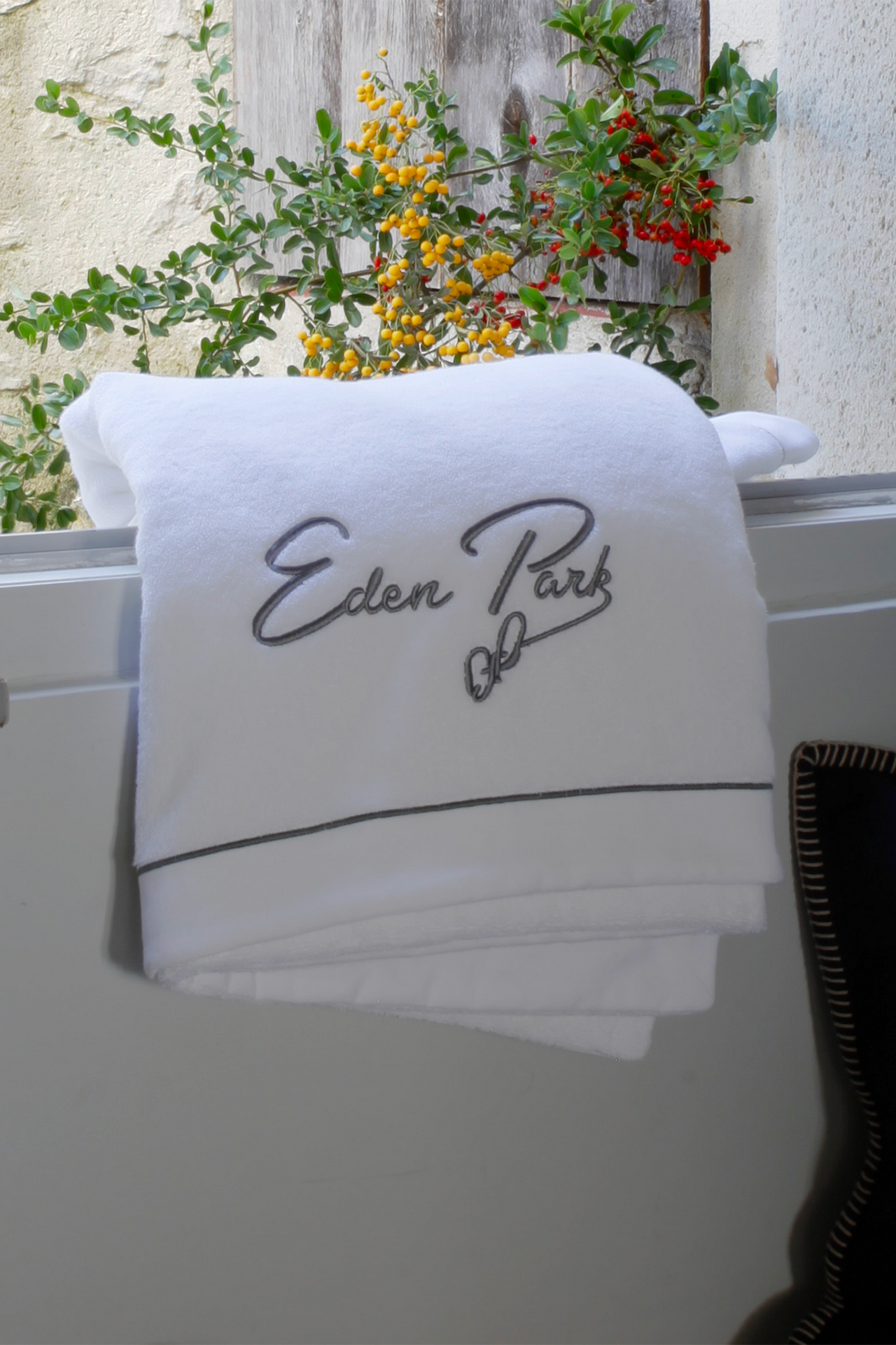 Large bath towel with grey embroidery