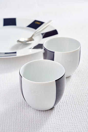 Set of two porcelain coffee cups with blue glazed interior