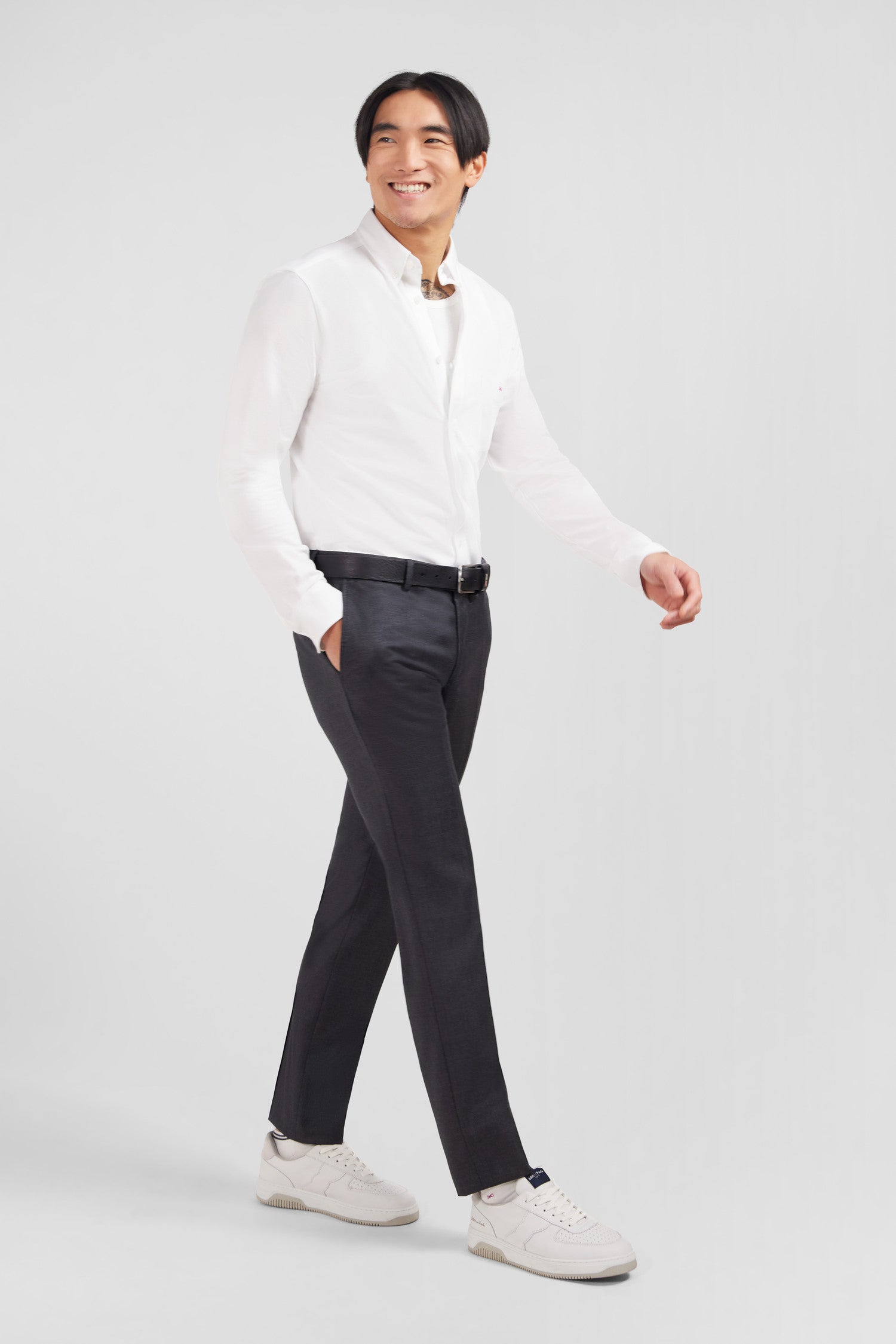 Slim grey wool trousers with broken fold