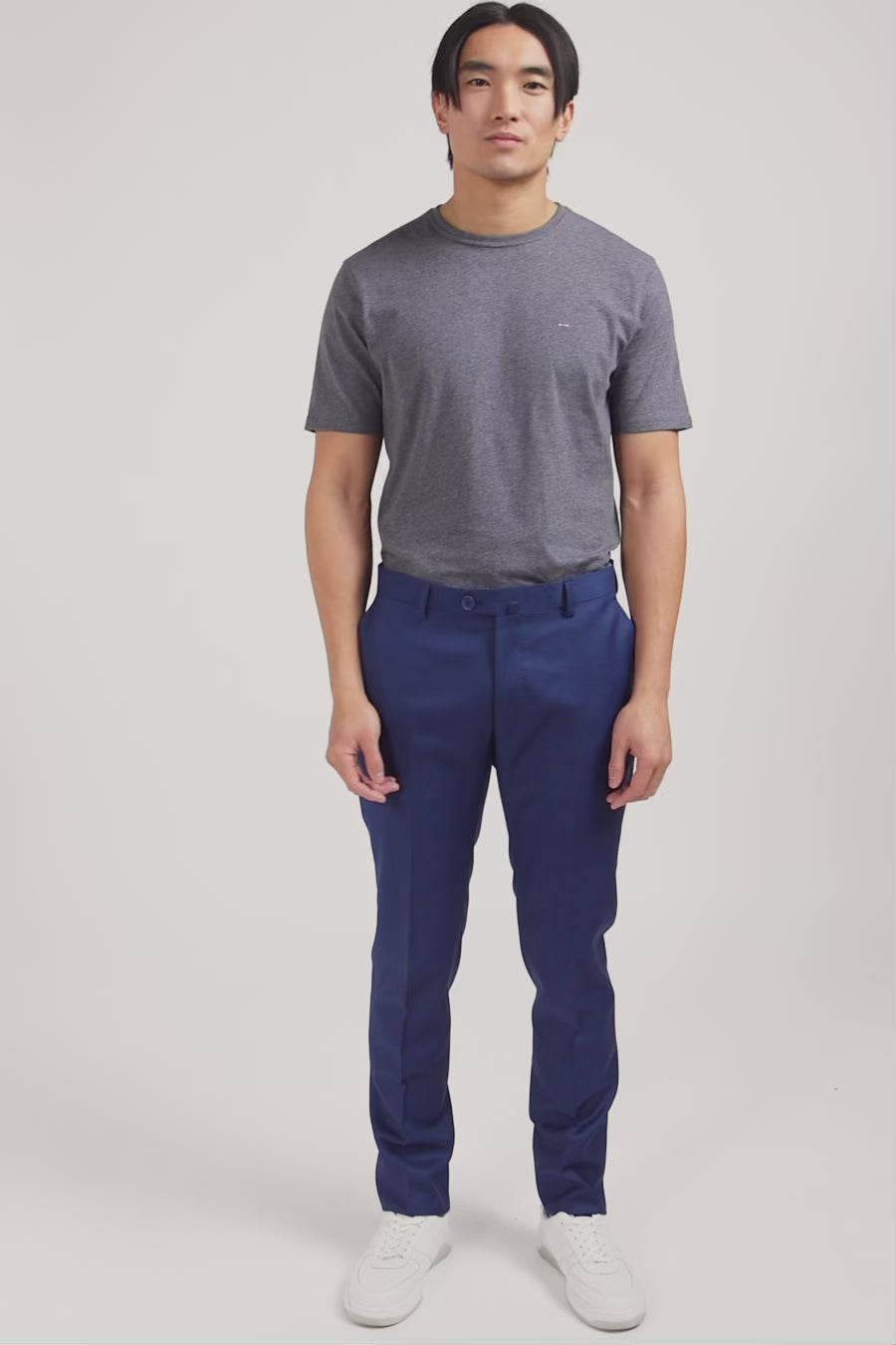 Slim blue wool trousers with broken fold