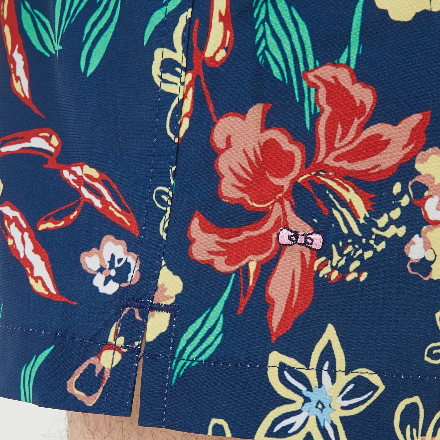 Navy blue swim shorts with floral pattern