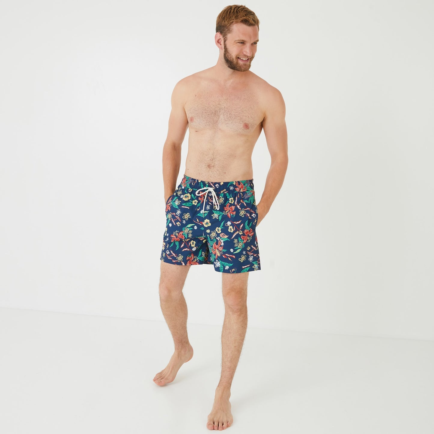 Navy blue swim shorts with floral pattern