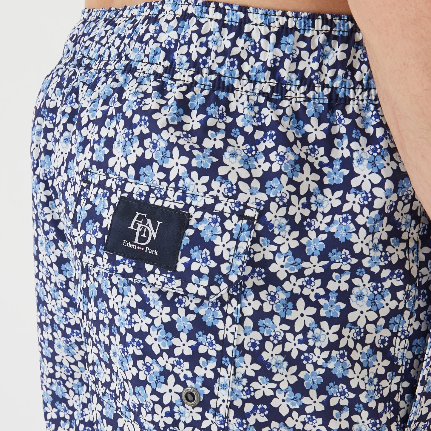 Blue swim shorts with floral pattern