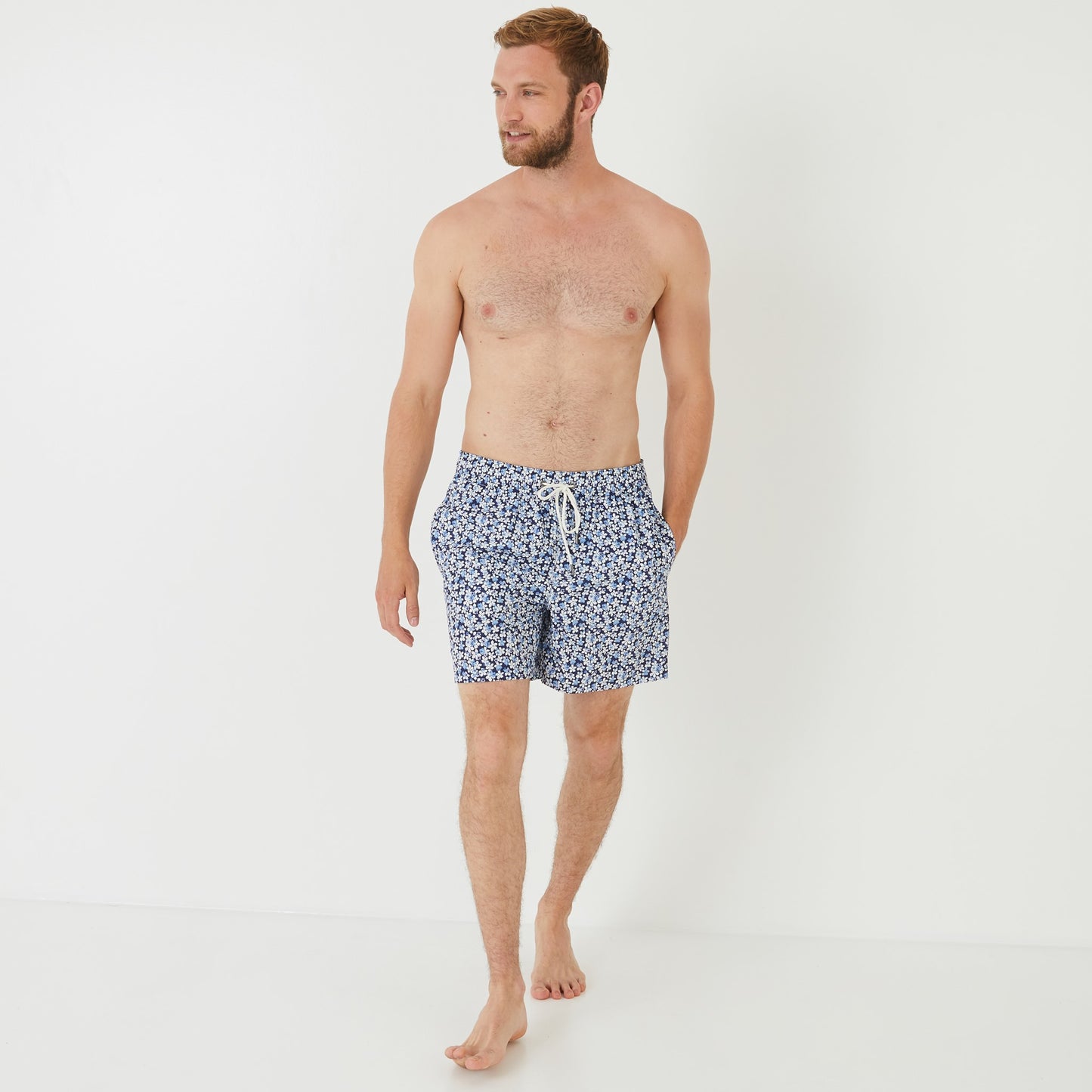 Blue swim shorts with floral pattern