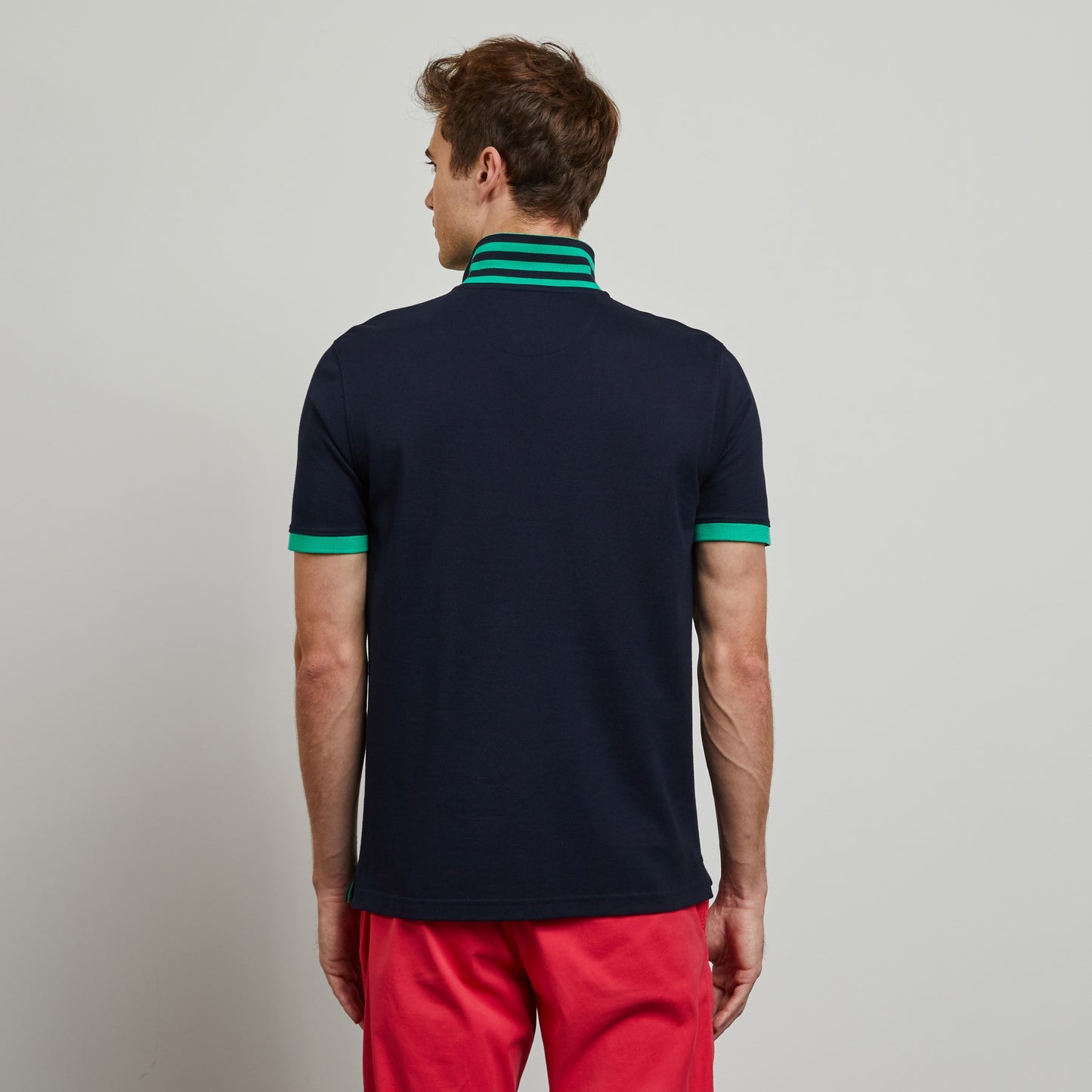 Dark blue polo with green trims, in Pima cotton